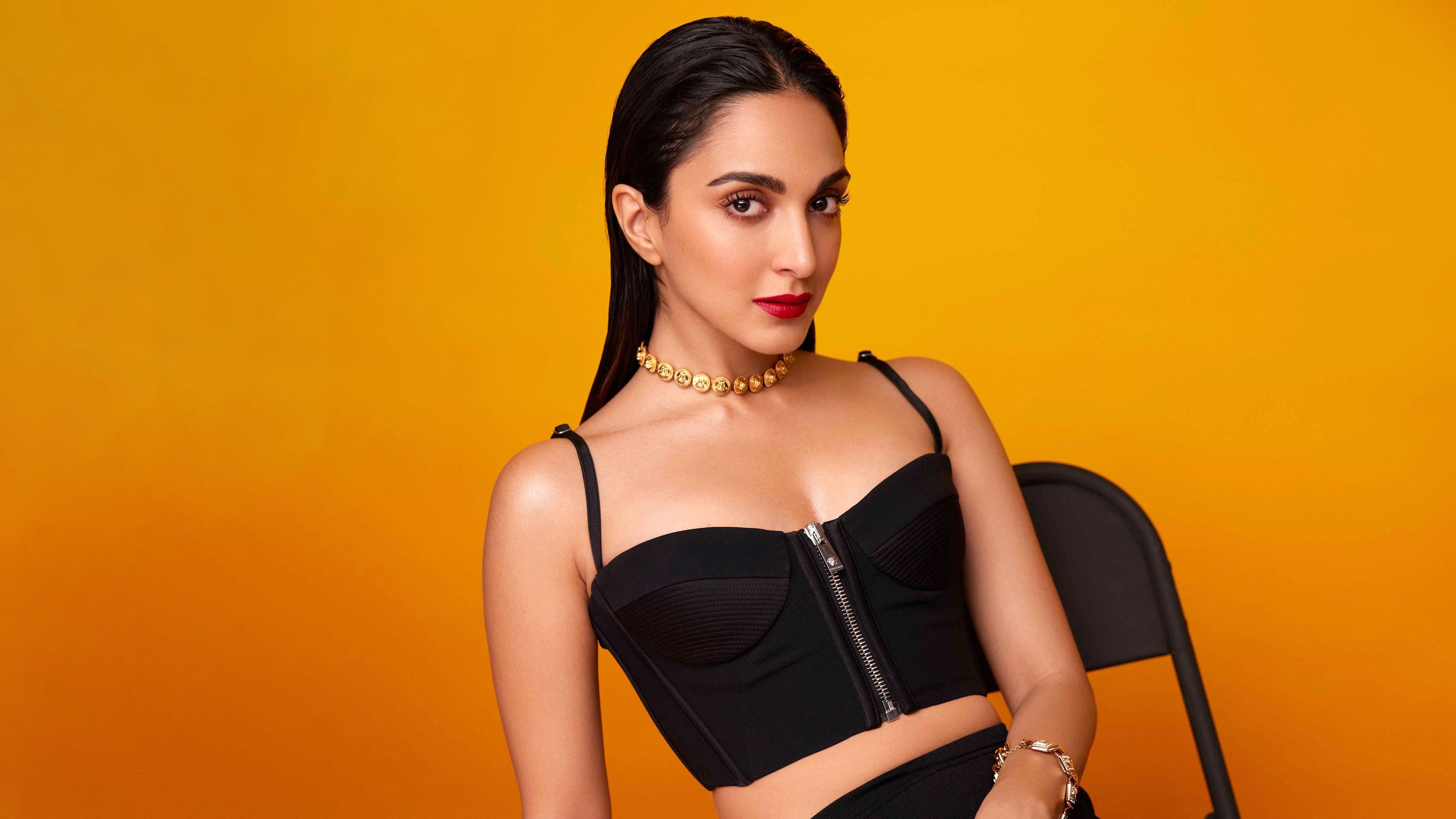 3840x2160 Kiara Advani Wallpaper 4K, Black dress, Orange background