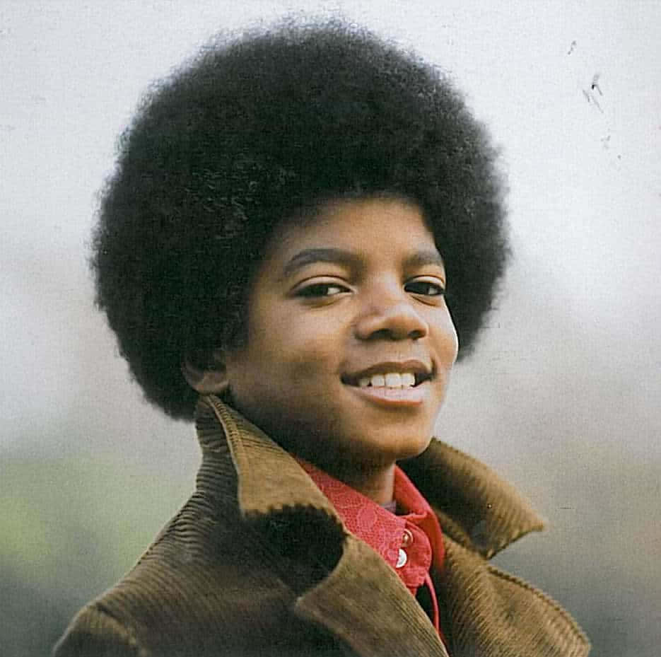 935x929 Download A Young Boy With An Afro Smiles For The Camera