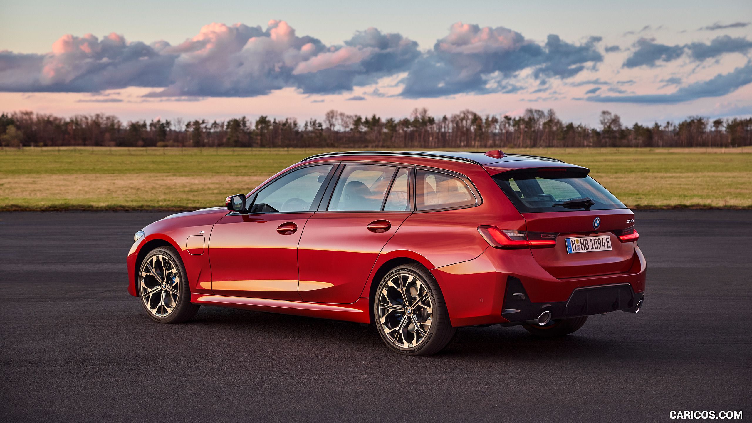 2560x1440 BMW 3 Series TouringMY (Color: Fire Red). Rear Three Quarter