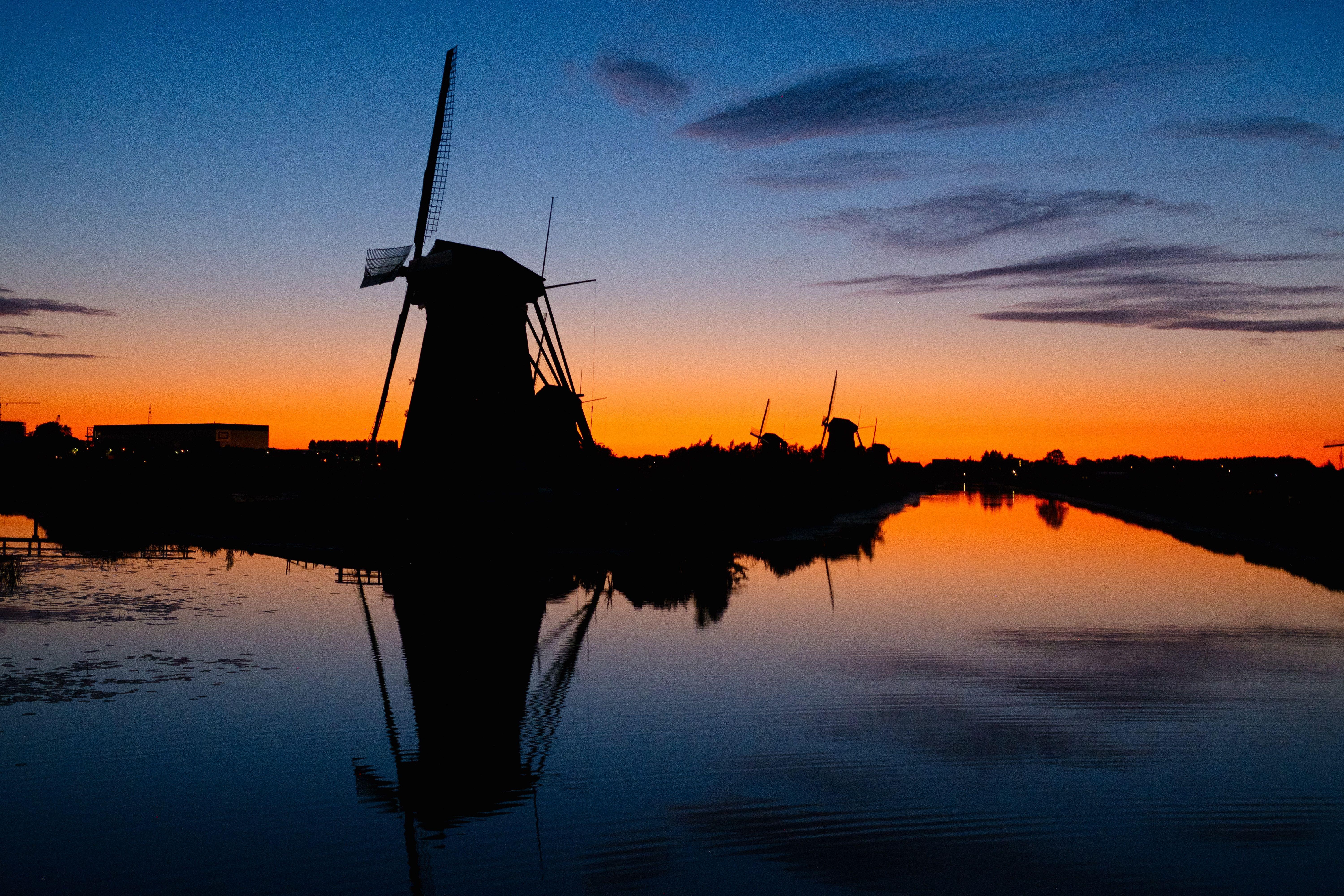 6000x4000 Download wallpaper 6000x4000 mills, silhouette, sunset, river HD