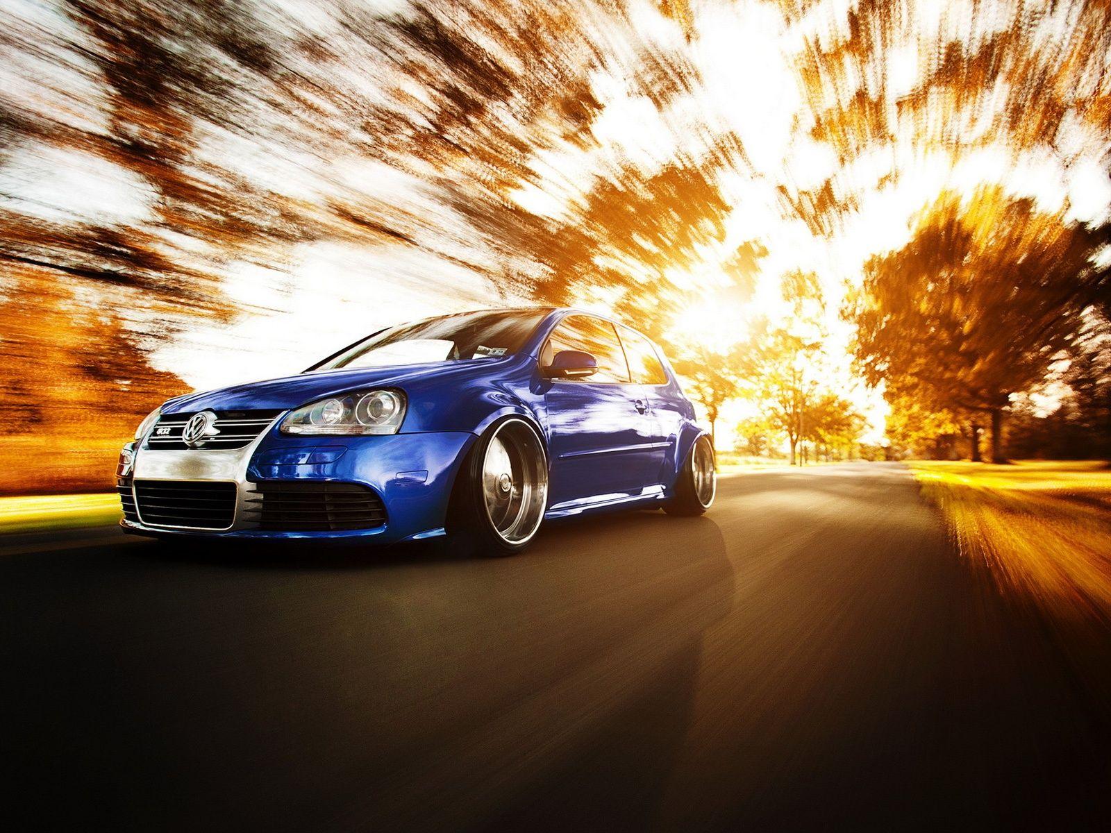 1600x1200 Wallpaper Volkswagen Golf car in high speed road, autumn sun
