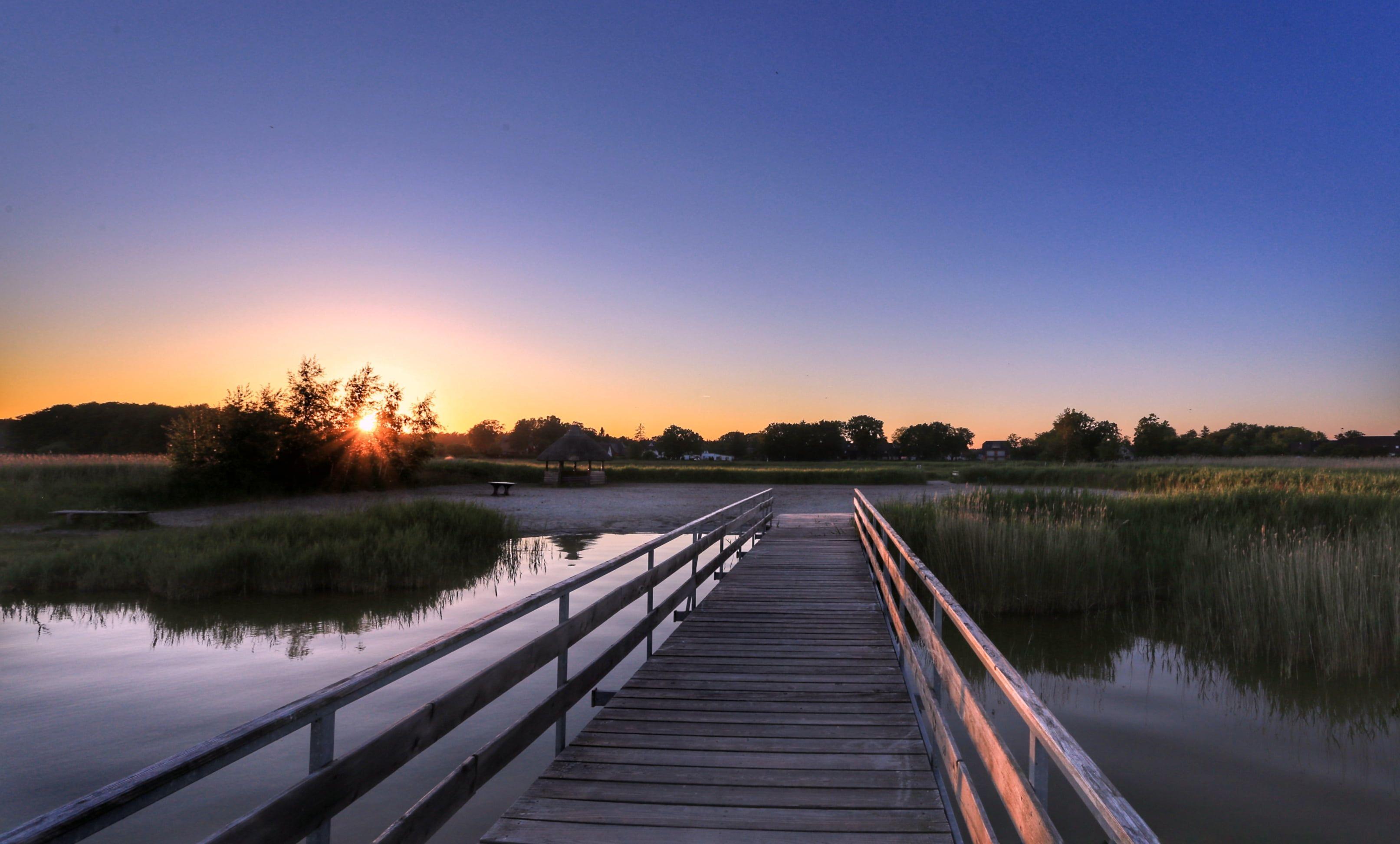 3226x1946 Brown wooden bridge near lake during sunset HD wallpaper