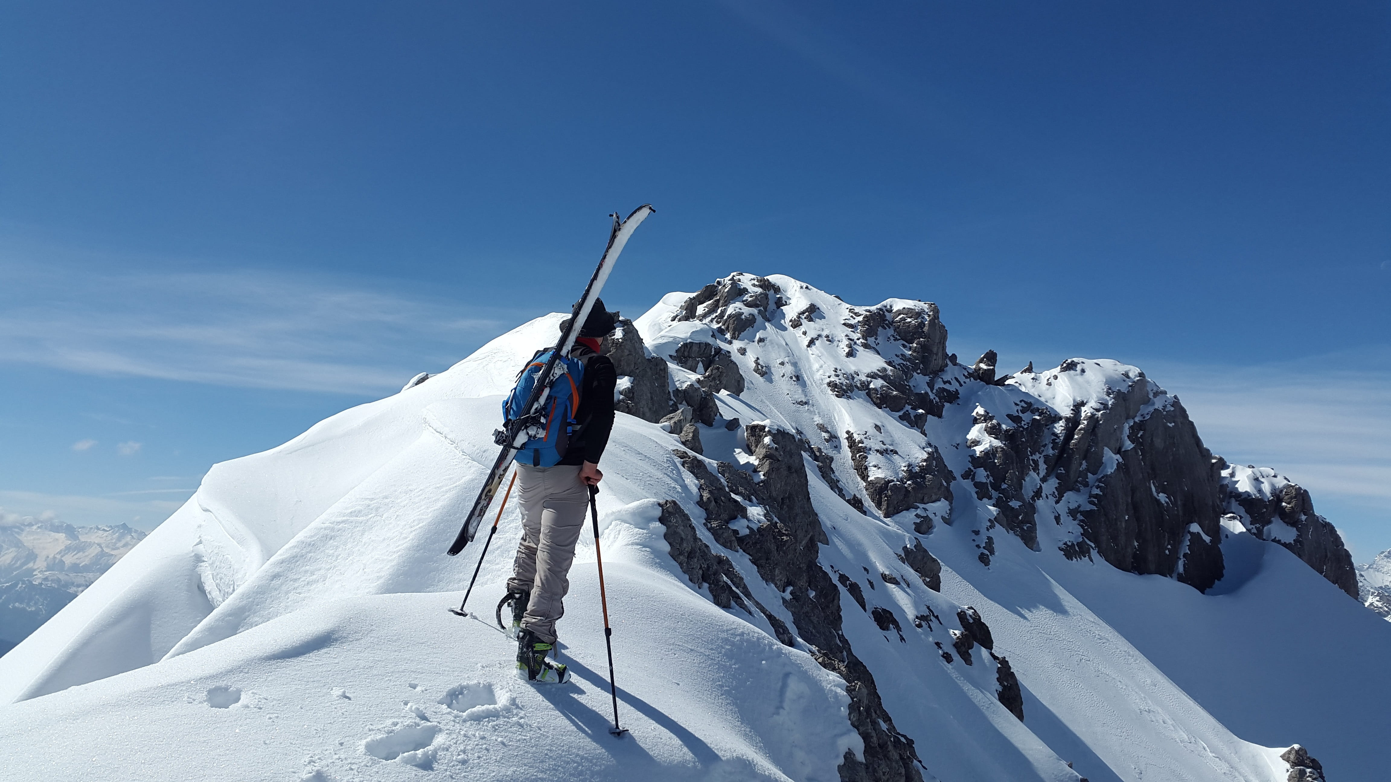 4608x2592 Royalty Free Photo: Man Wearing Blue Backpack On Snow Covered Mountain During Daytime