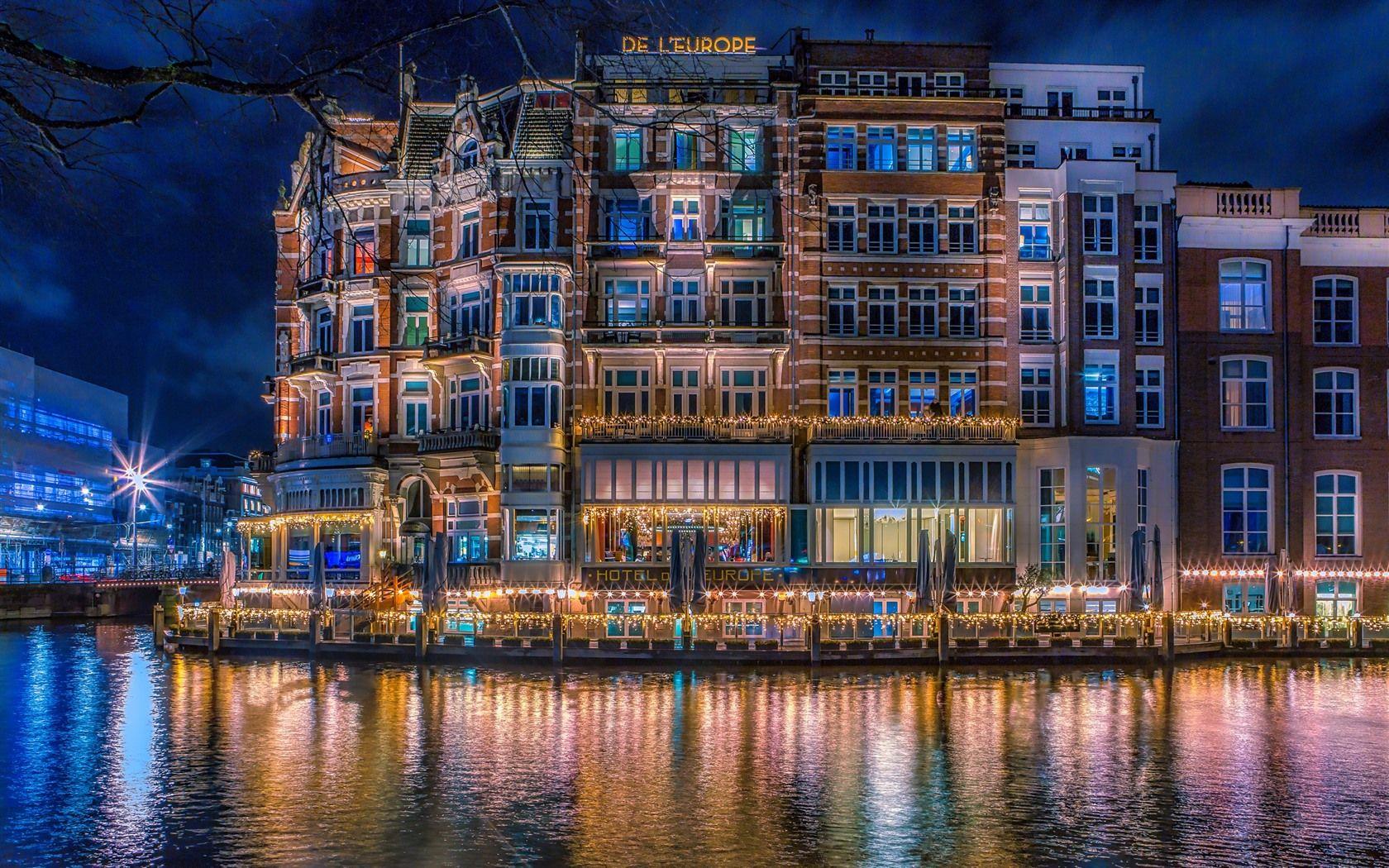 1680x1050 Wallpaper Netherlands, Amsterdam, city night, houses, river