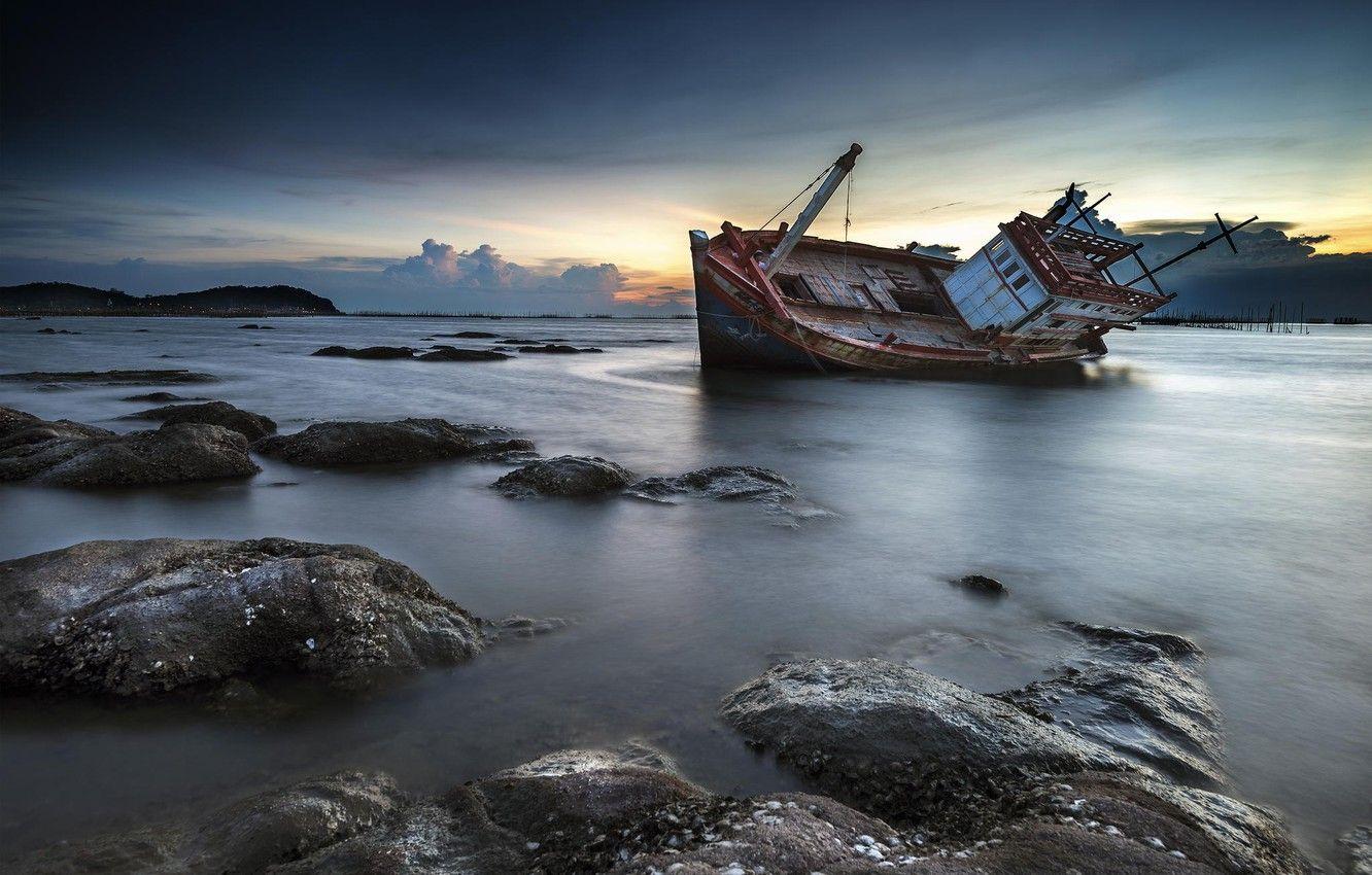 1332x850 Wallpaper sunset, stones, shore, ship, twilight, shipwreck image