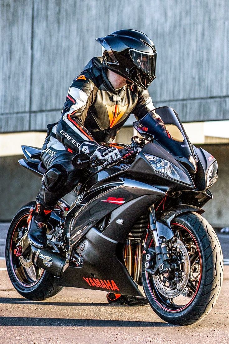 735x1102 Hot Biker in a Cool AGV Pista GP R Helmet Riding His Yamaha R6 Motorcycle