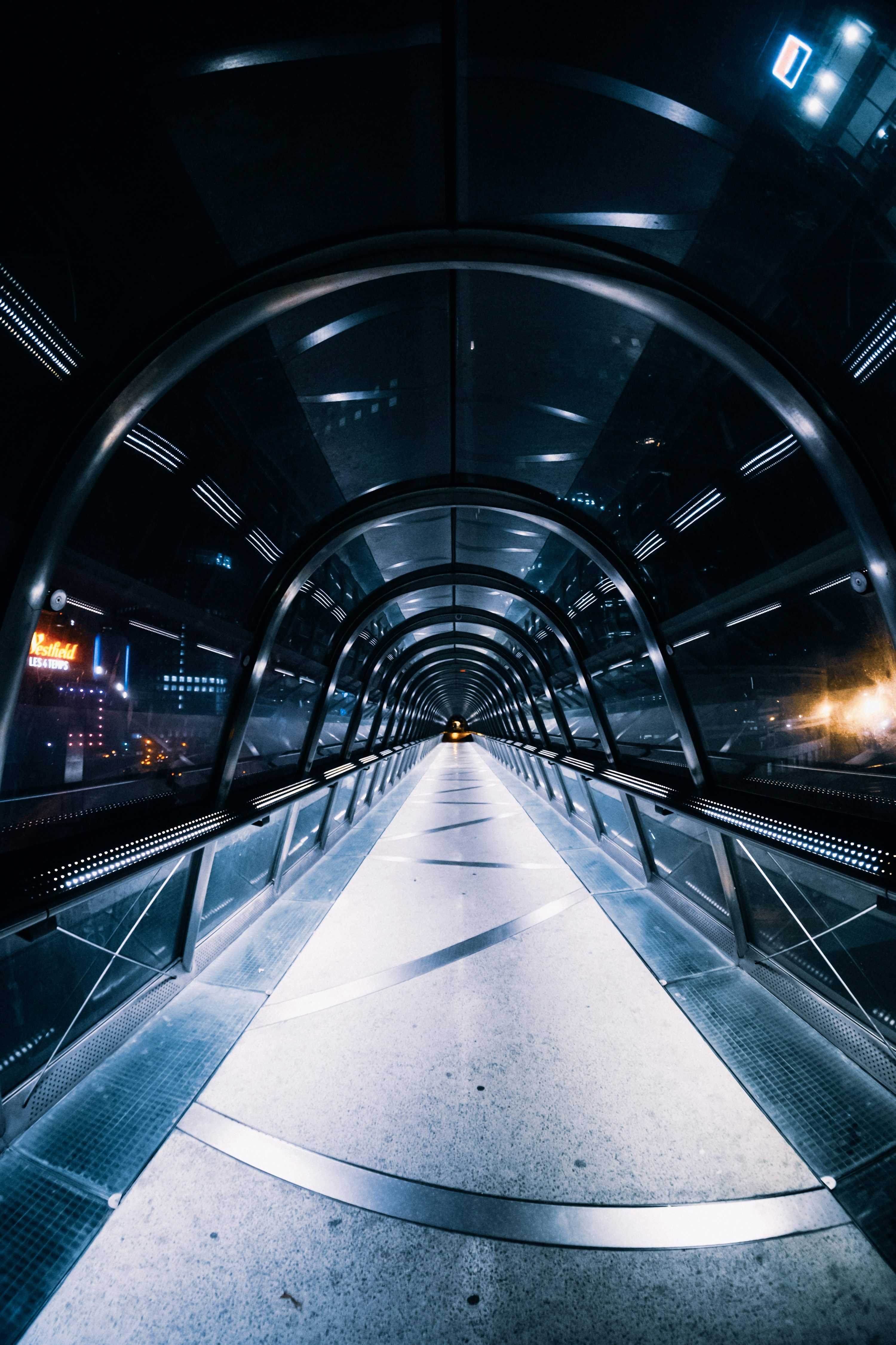 3000x4500 A very long tunnel with some lights in it photo