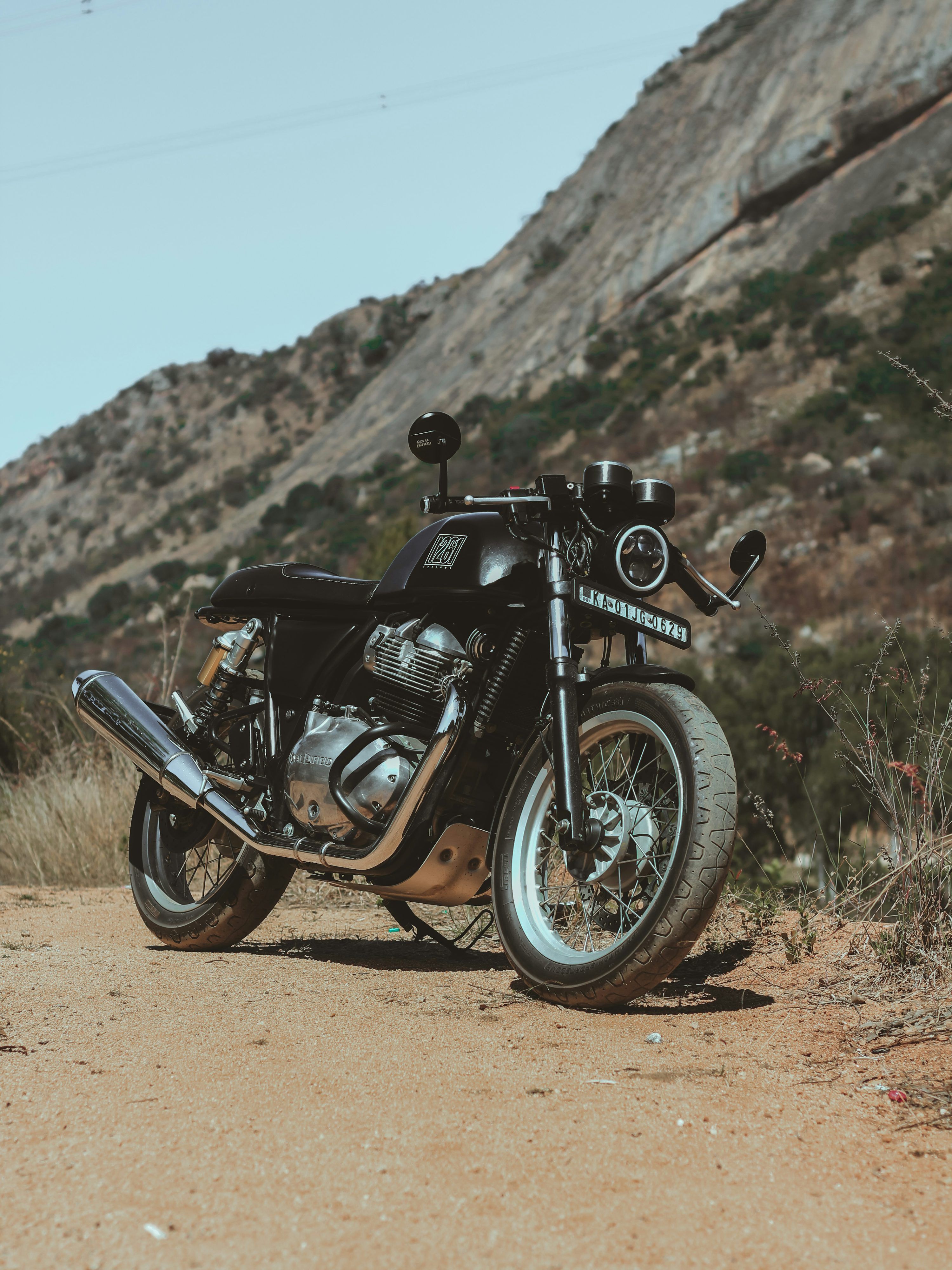 3000x4000 Black and gray motorcycle on brown field during daytime photo