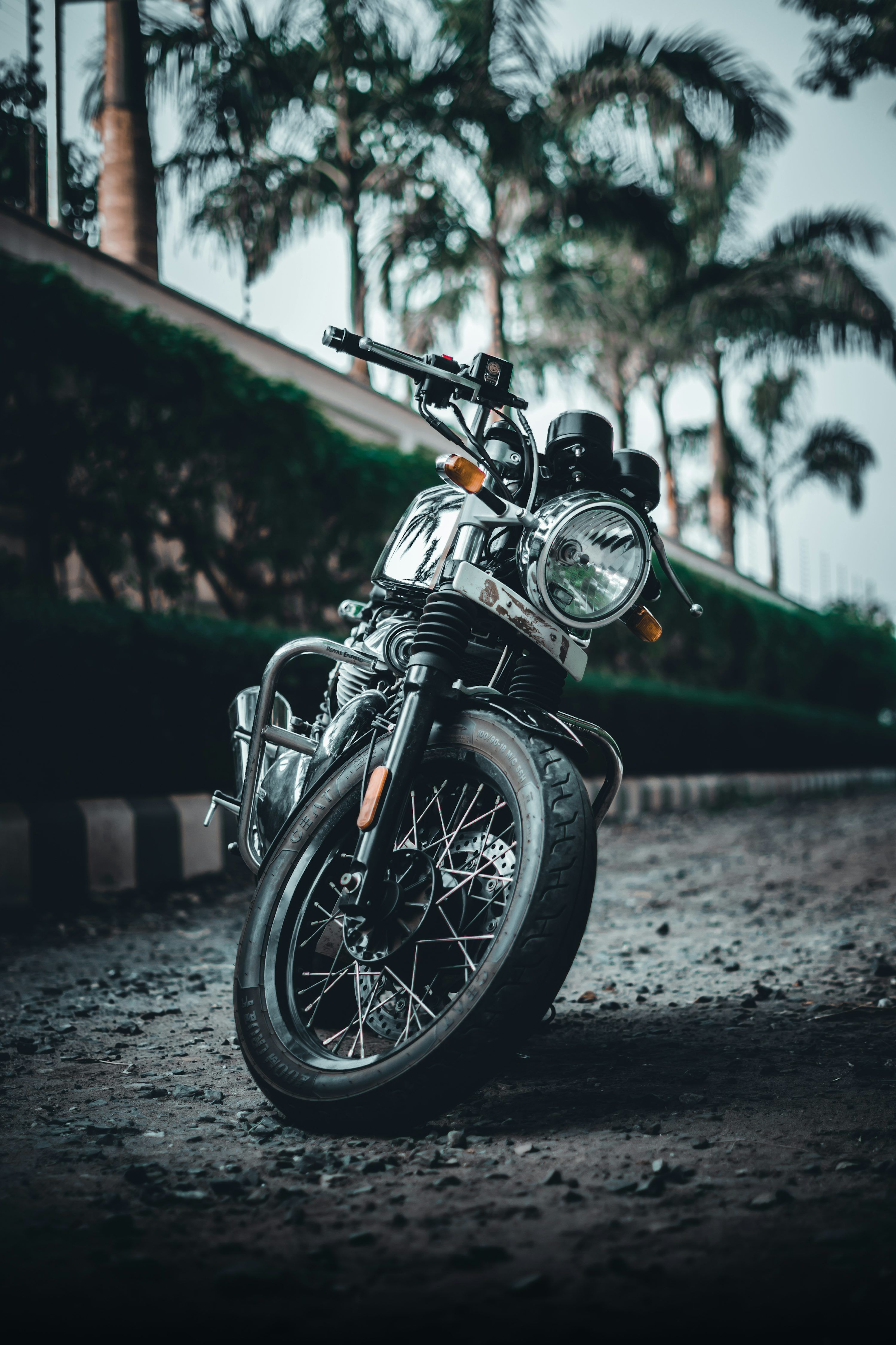 3000x4500 A motorcycle parked on a dirt road in a field photo