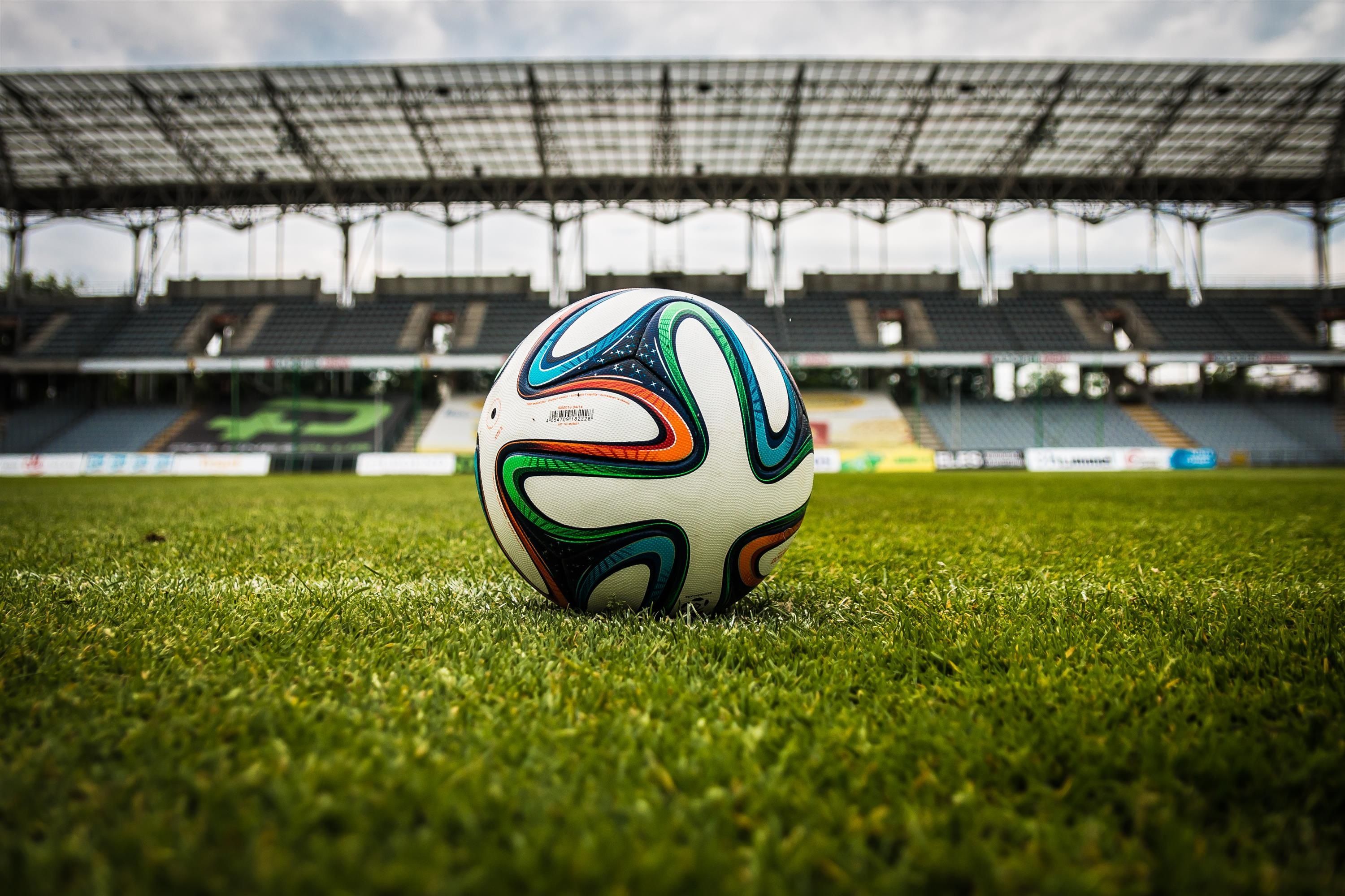 3000x2000 Multicolored Soccer Ball on Green Field · Free