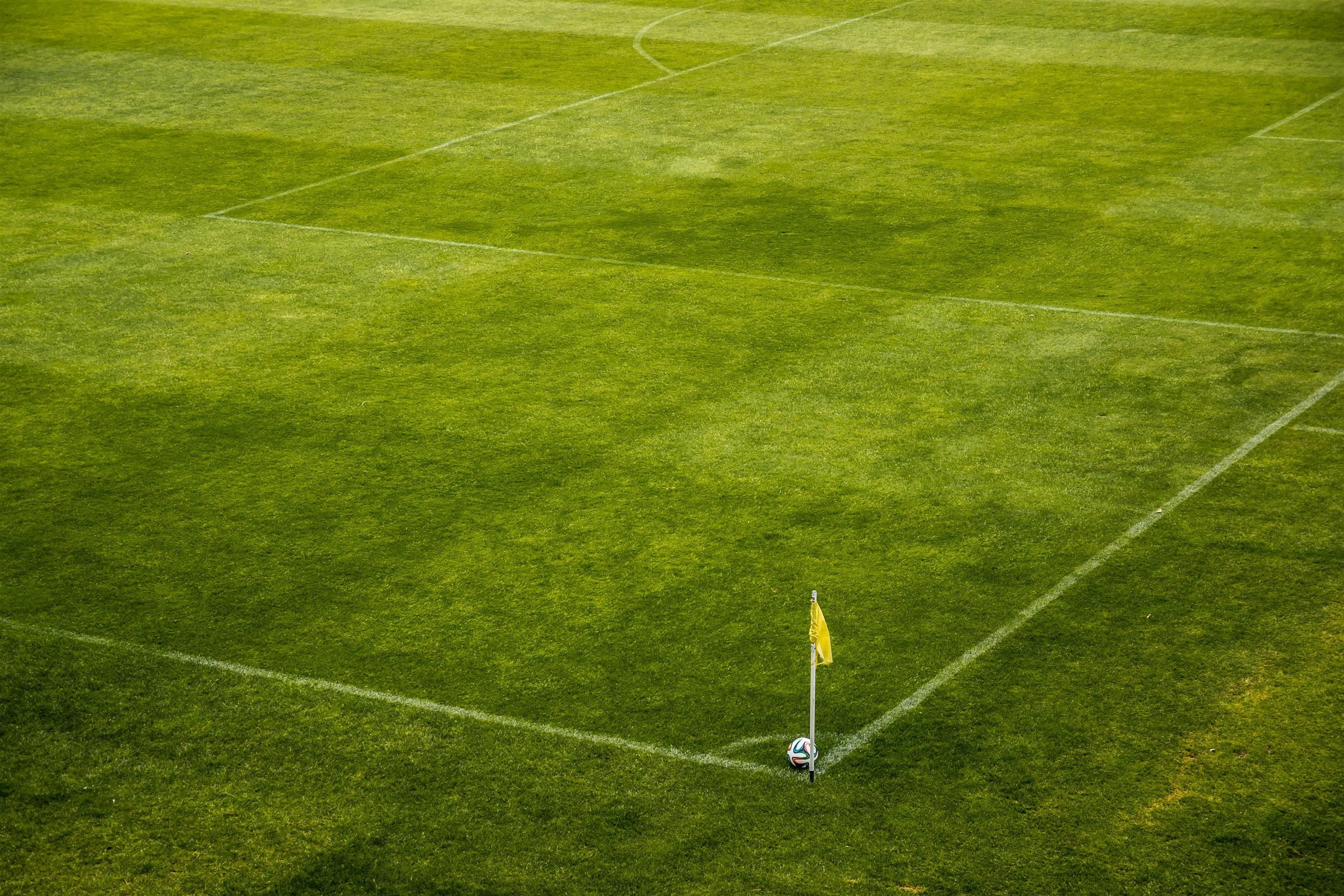 3000x2000 White and Black Soccer Ball on Side of Green Grass Field during Daytime · Free
