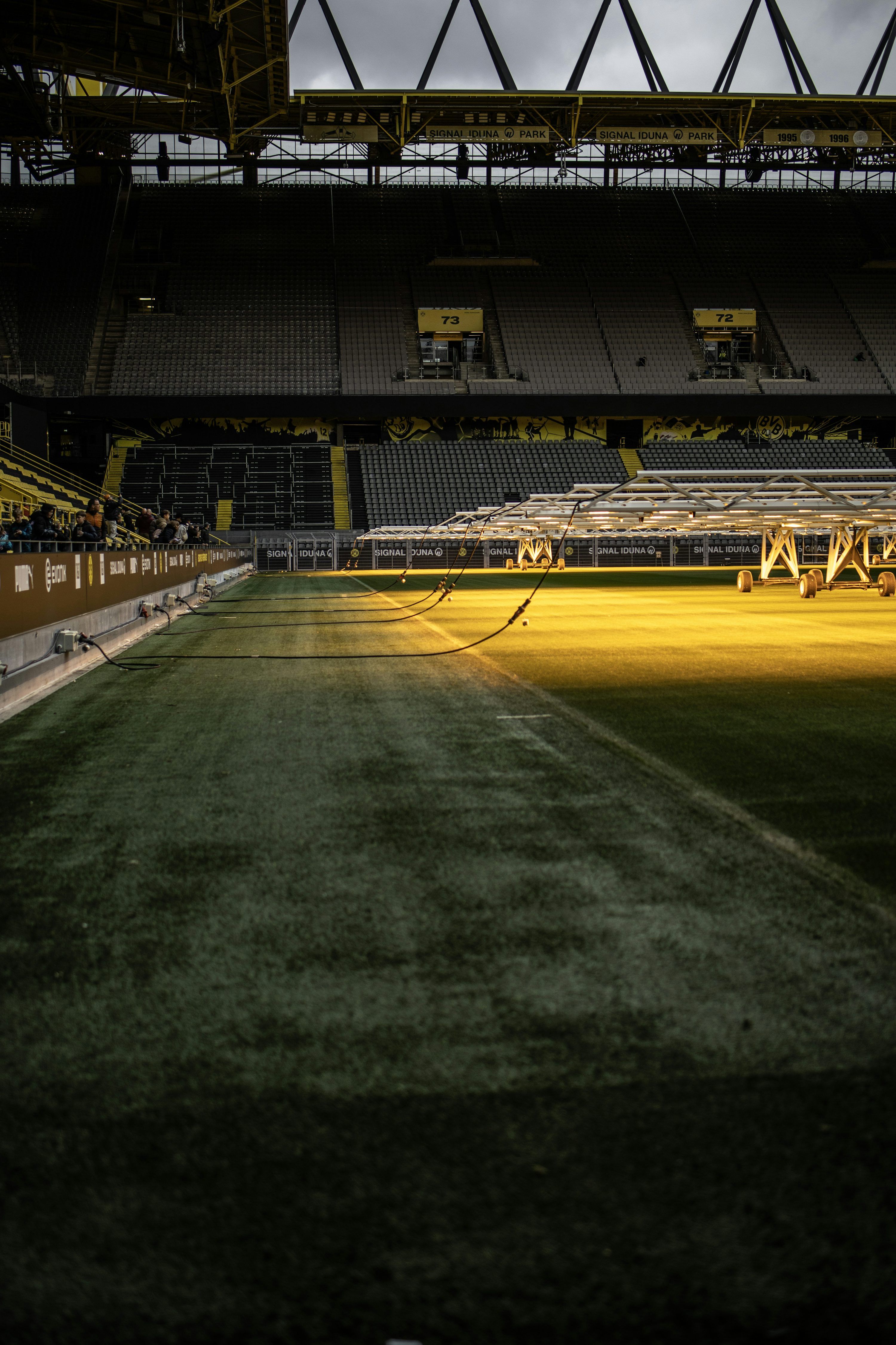 3000x4500 A large empty stadium with a yellow field photo