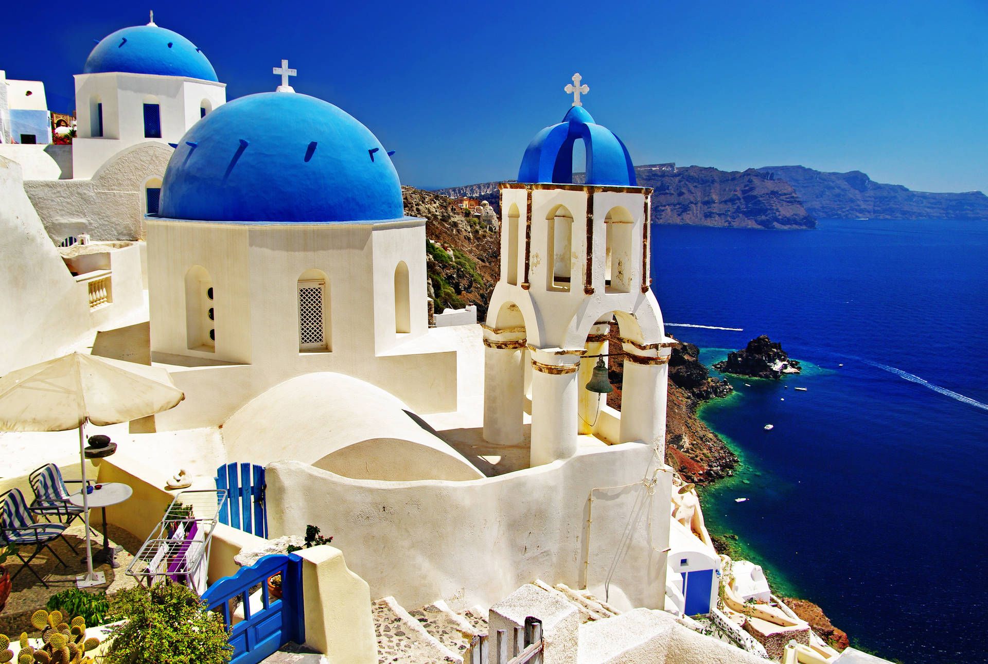 1920x1291 Download Country Summer in Santorini roofs contrasting with golden sunlight Wallpaper