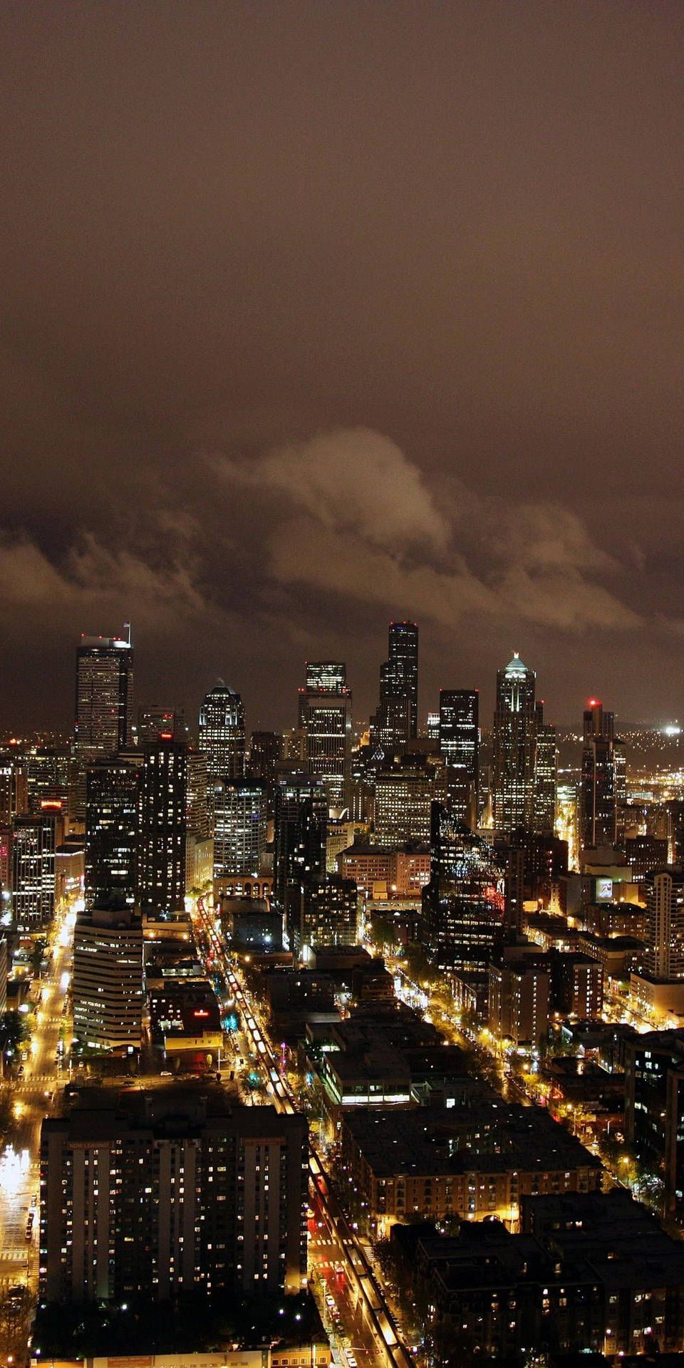 960x1920 Download A view of the glimmering City, At Night Wallpaper