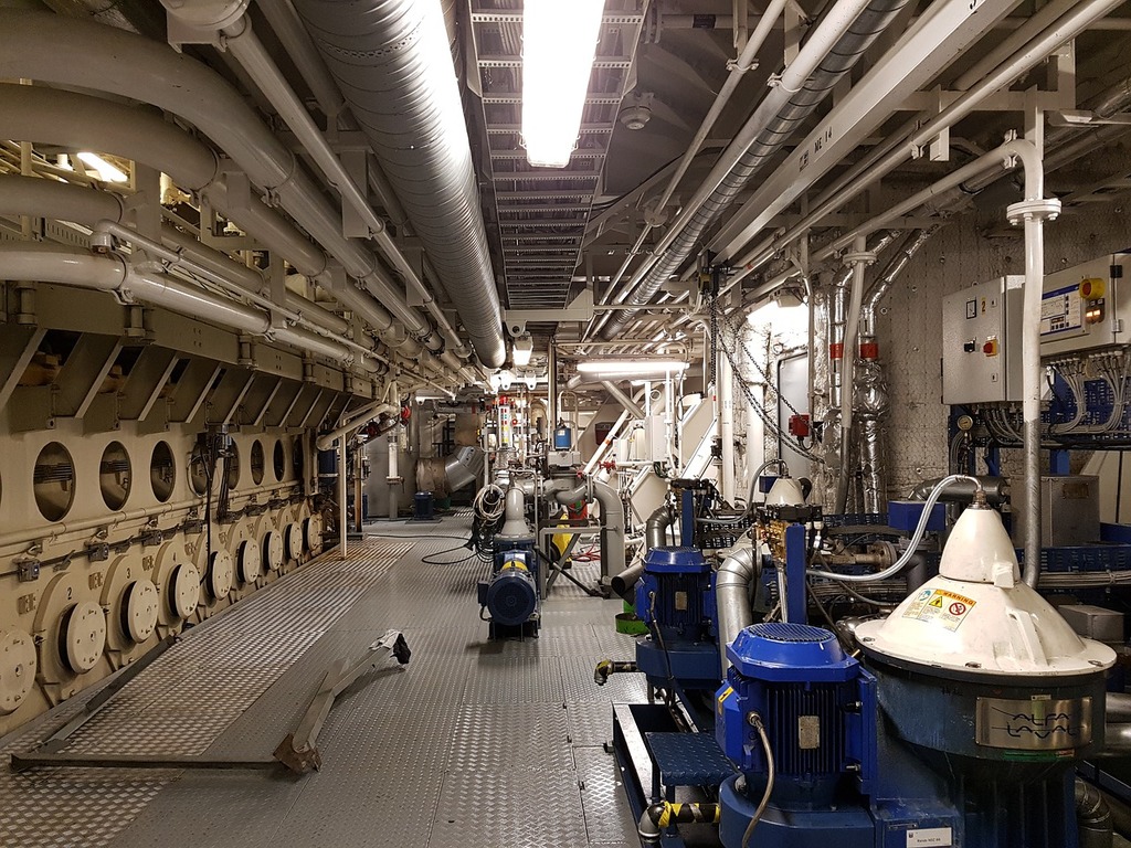 1024x768 A large room with a lot of pipes and valves. Technology