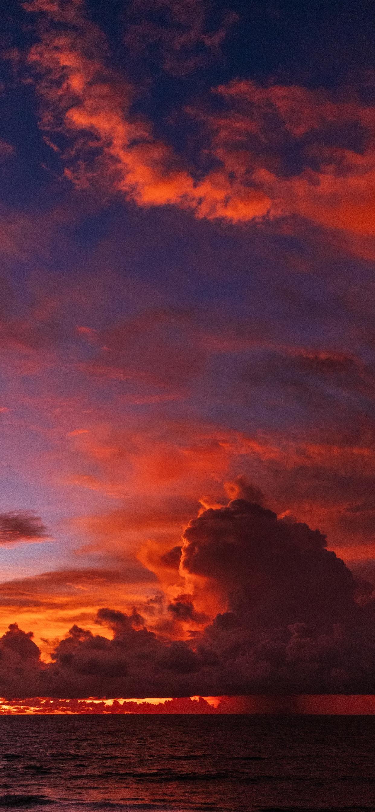 1242x2688 ocean under orange colored clouds iPhone X Wallpaper Free Download