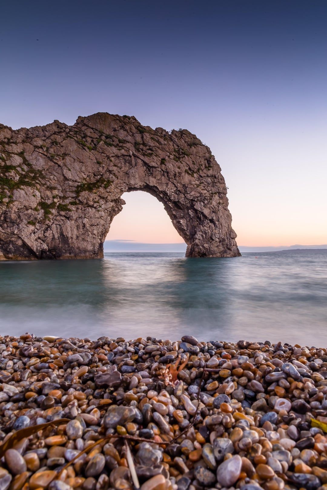 1080x1620 Durdle Door at sunset, Dorset, UK. [OC] [3438 x 5157]
