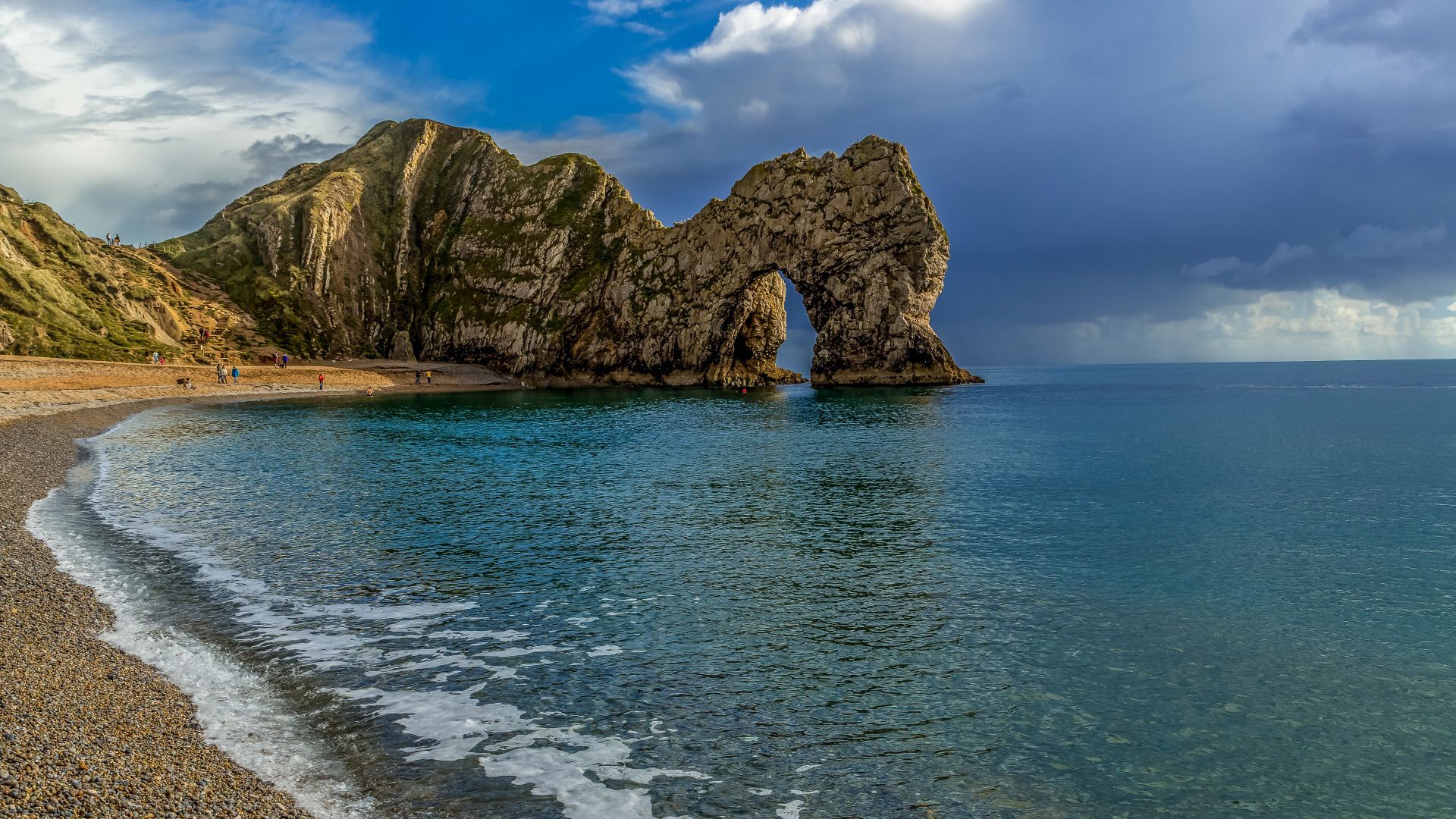 1920x1080 Durdle Door In The Middle Of Ocean Under Blue Sky HD Nature Wallpaper