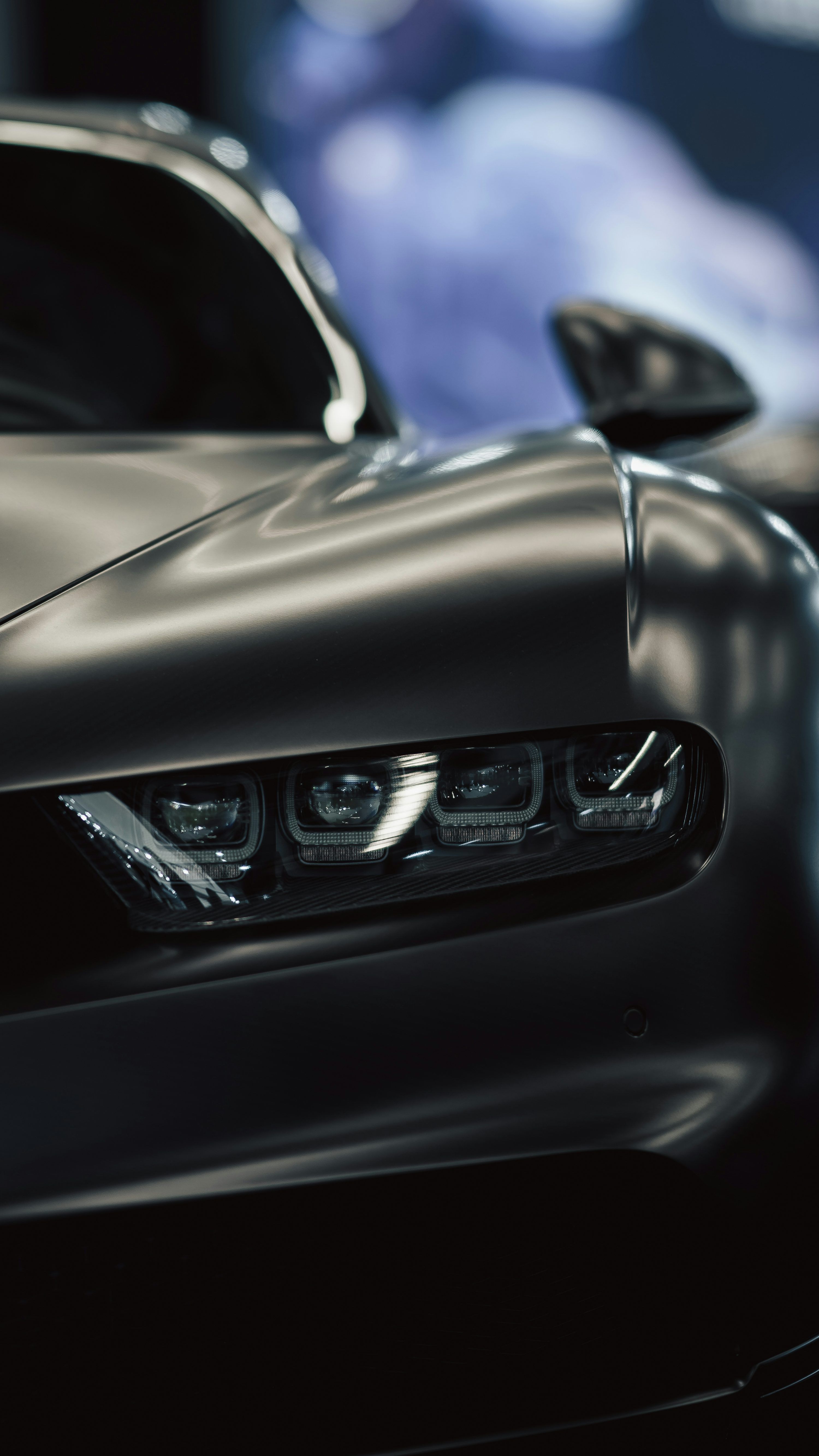 3000x5333 A close up of a car with a blurry background photo