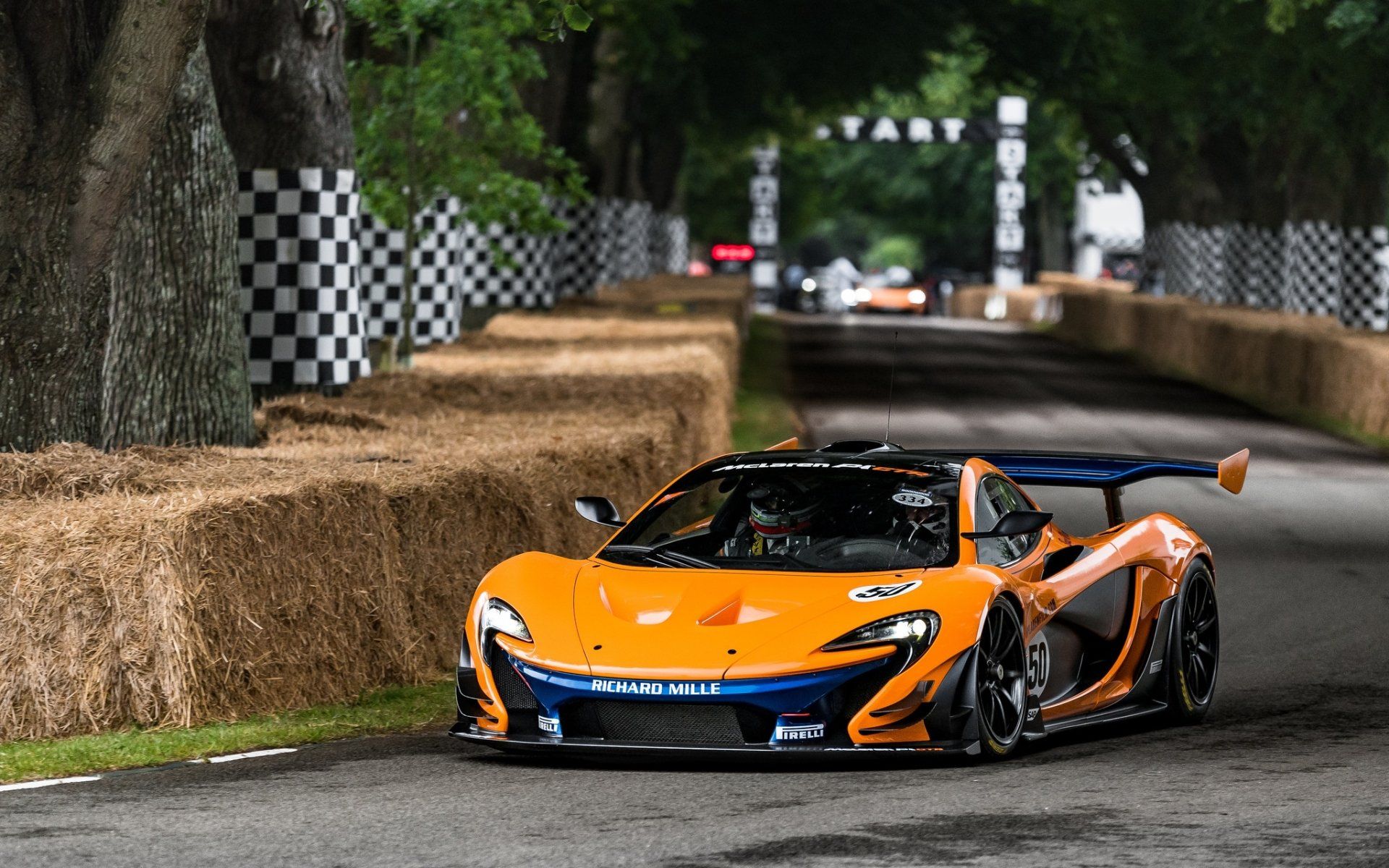 1920x1200 Sleek Orange McLaren P1 Supercar Racing Down the Track
