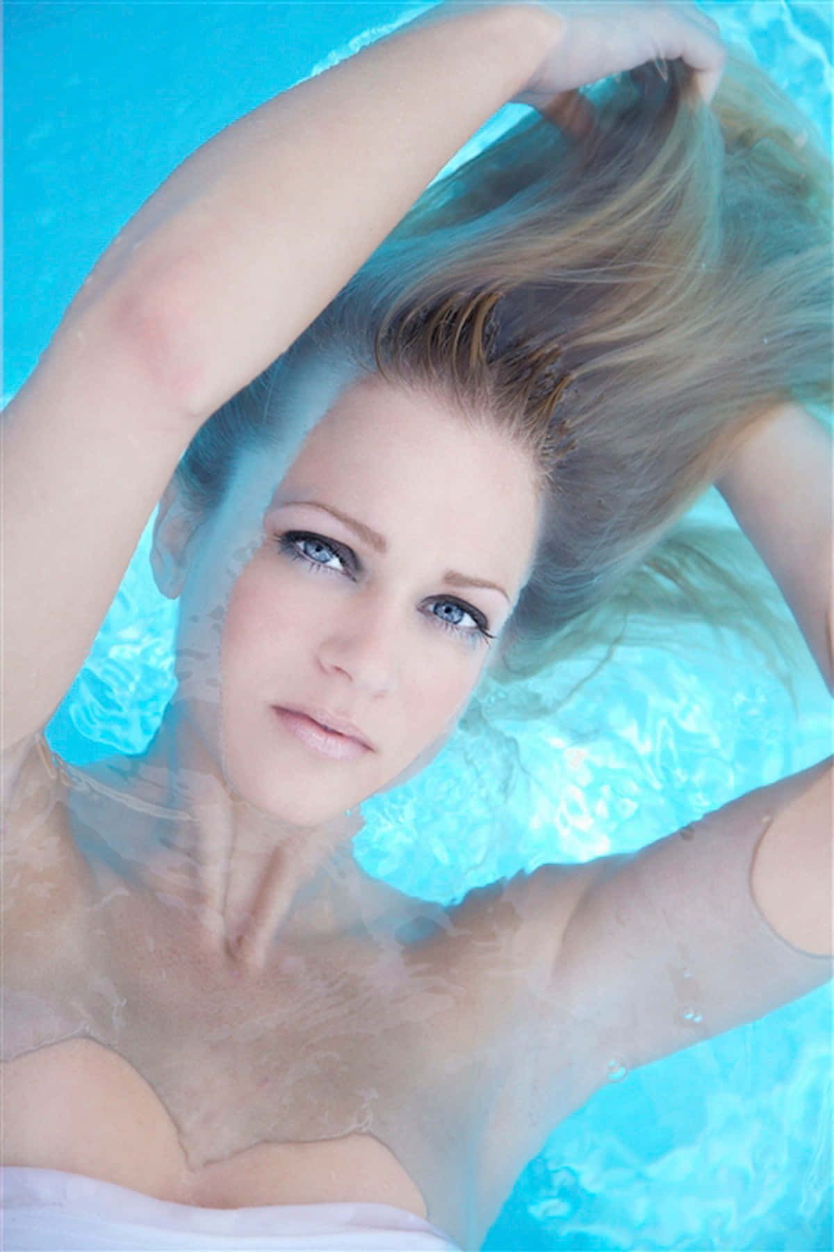 1200x1800 Download AJ Cook striking a pose in a stunning portrait Wallpaper