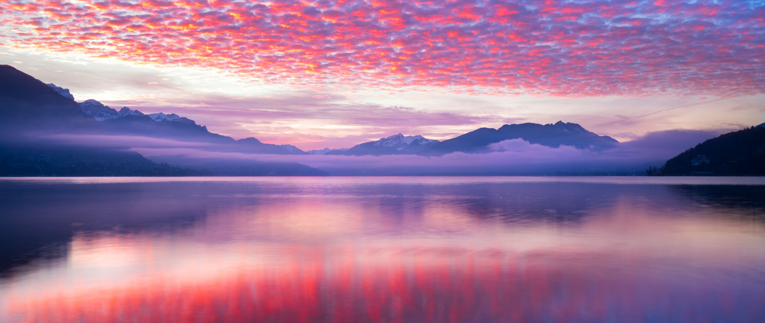 2560x1080 Download Pink clouds, Clouds, Sky, Mountains, Sea, Reflection, Snow Wallpaper in 2560x1080 Resolution