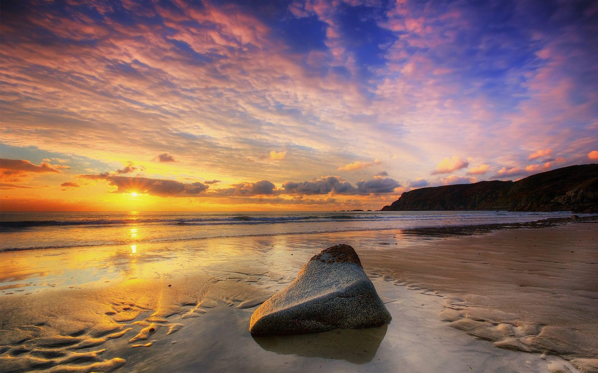 1920x1200 Wallpaper Beach sunset, sun, sea, cloudy sky, stone 1920x1200 HD