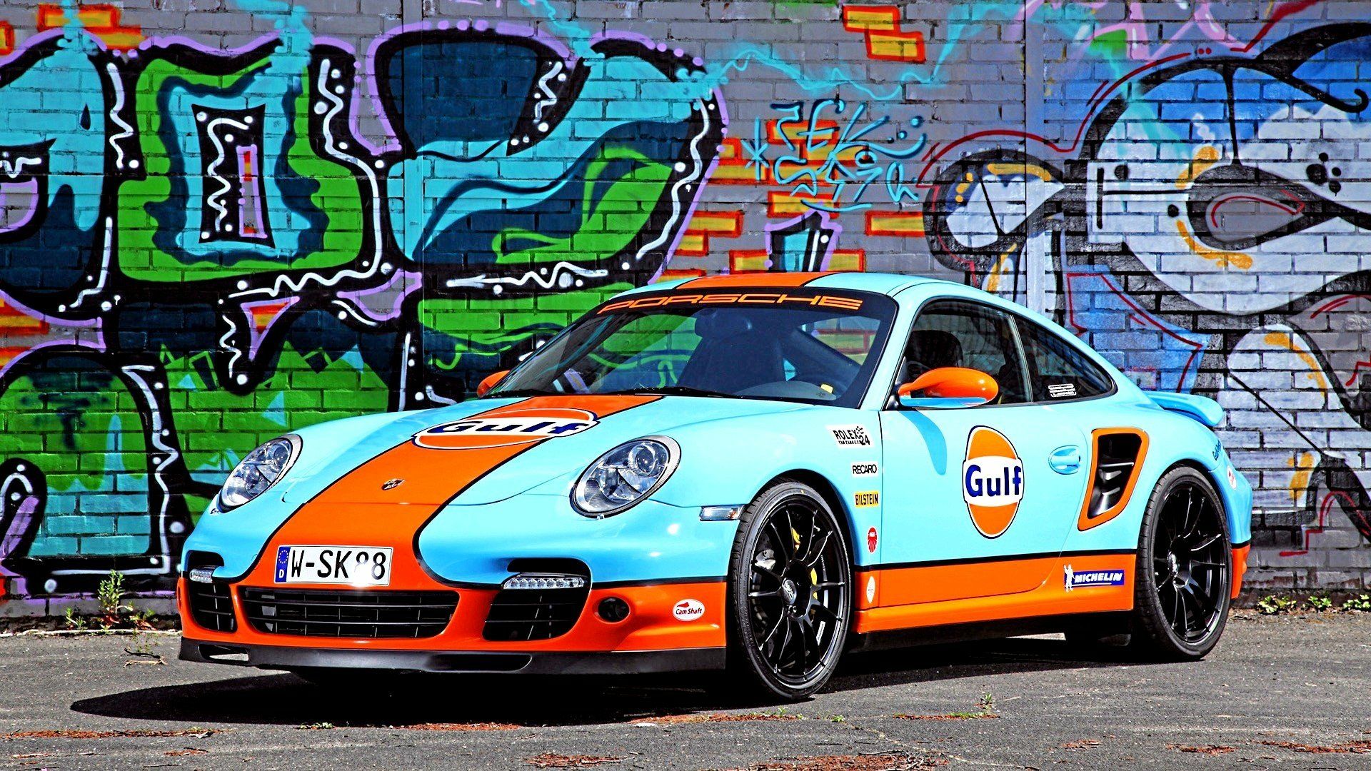 1920x1080 HD Porsche Gulf Racer: Iconic Sports Car in Vibrant Urban Graffitix1080