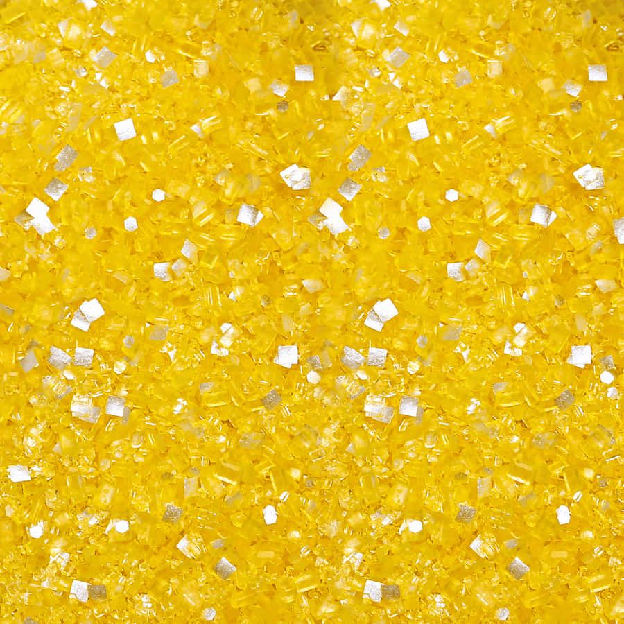 900x900 A Close Up Of A Yellow And Silver Glitter Wallpaper