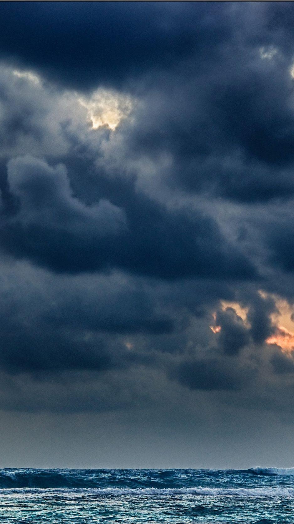 938x1668 Download wallpaper 938x1668 clouds, sea, storm, gloomy, heavy