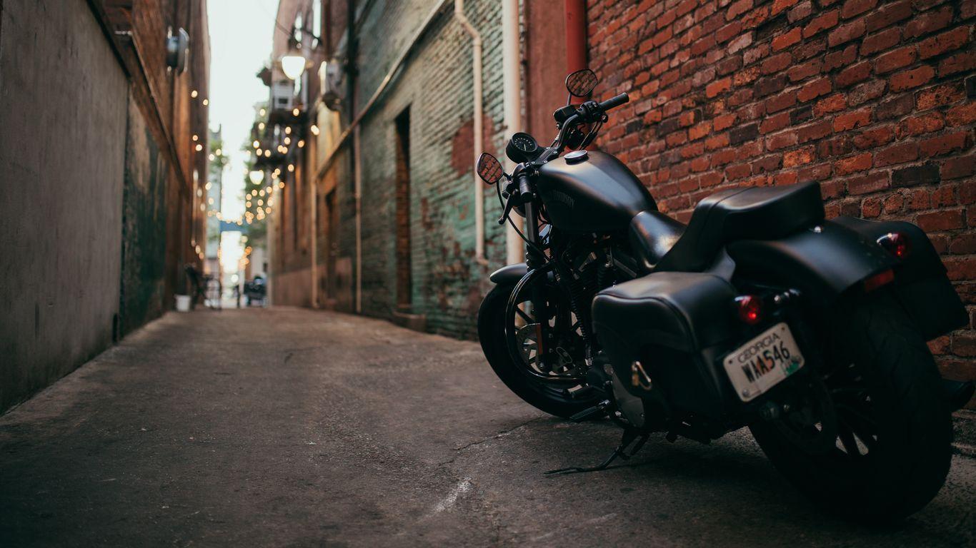 1366x768 Download wallpaper 1366x768 bike, motorcycle, side view, yard
