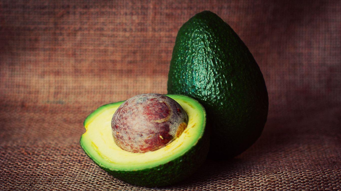 1366x768 Download wallpaper 1366x768 avocado, fruit, stone tablet, laptop