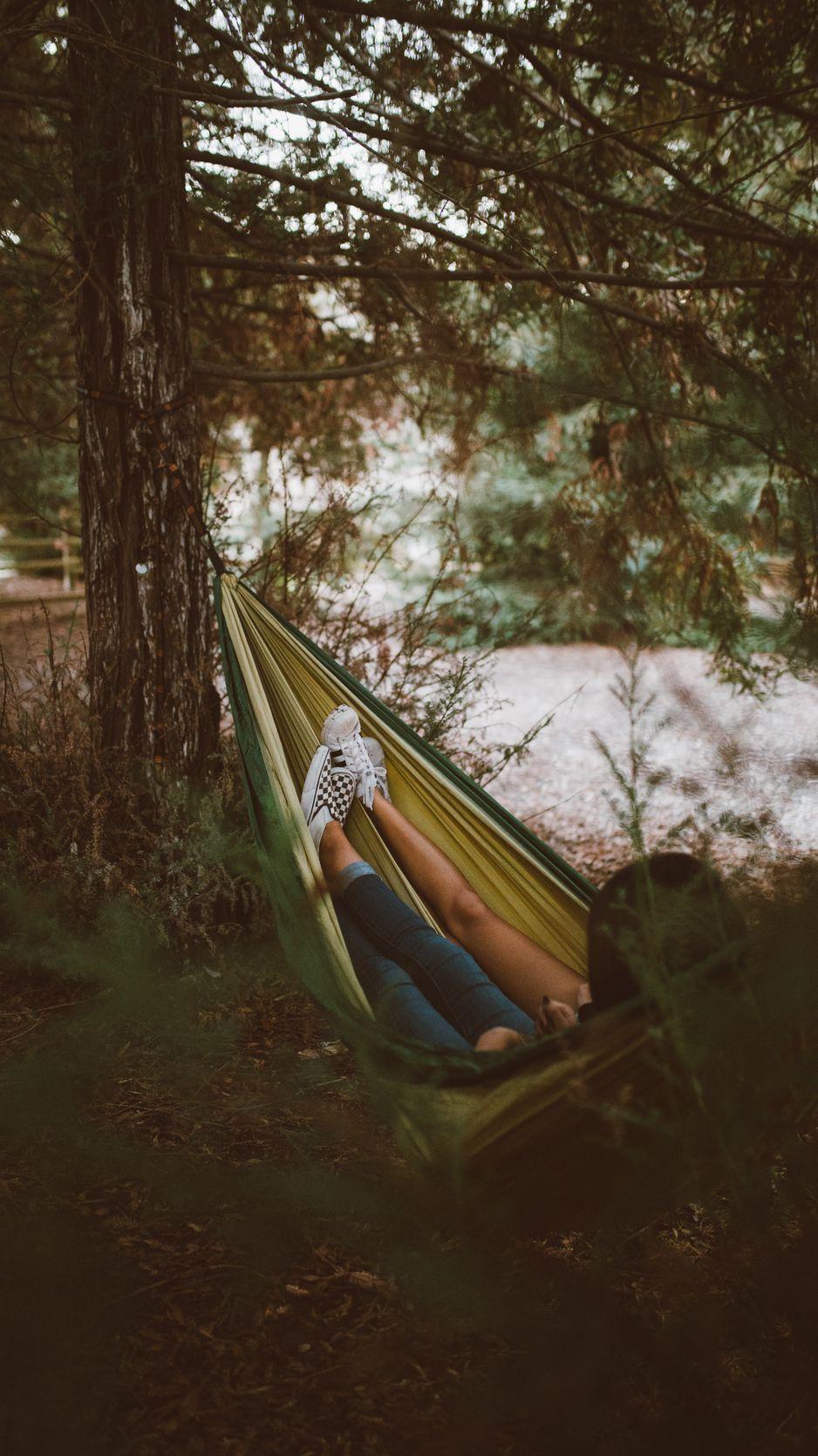 938x1668 Download wallpaper 938x1668 hammock, legs, camping, recreation