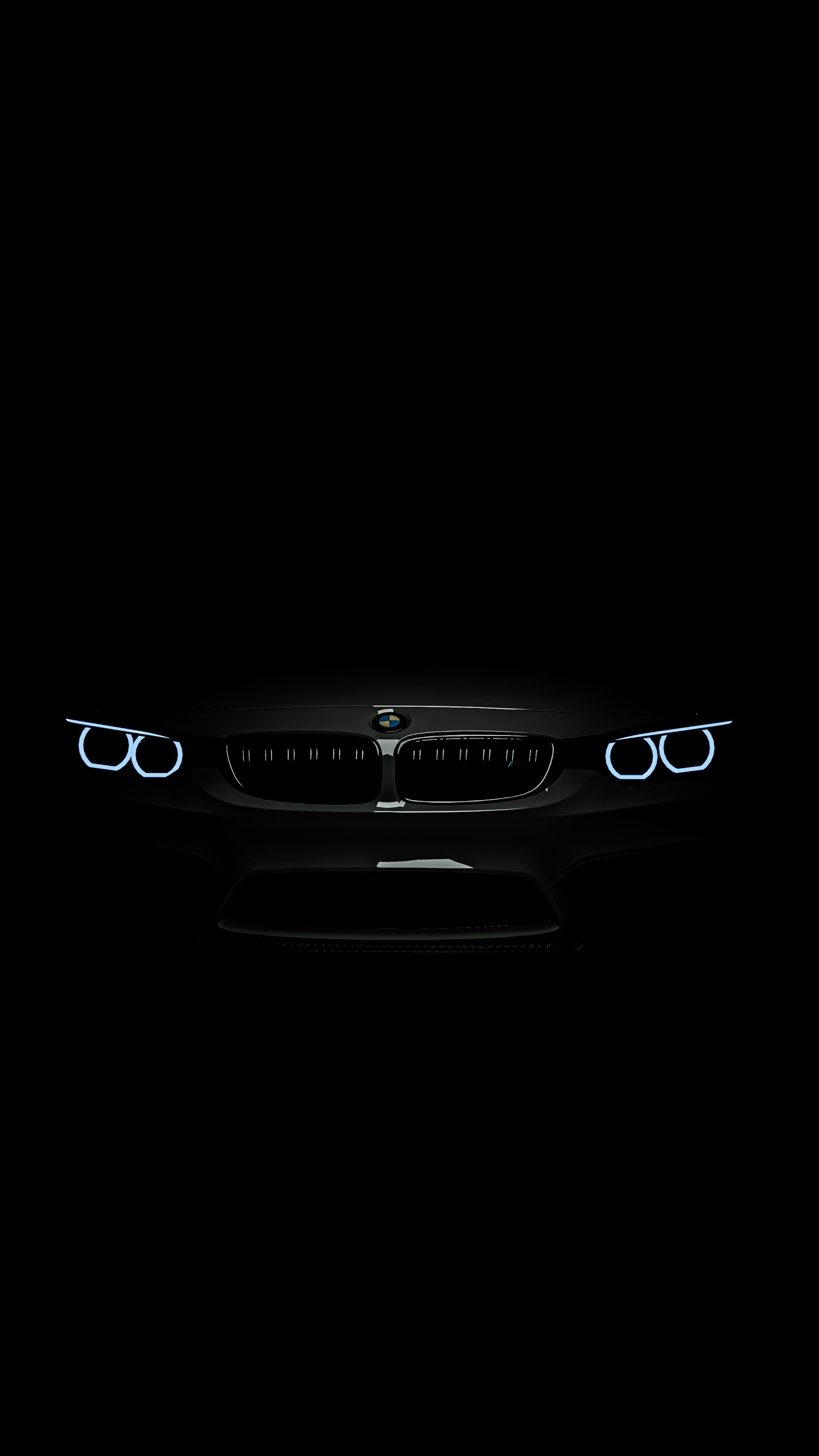 3000x5333 The front lights of a car in the dark photo