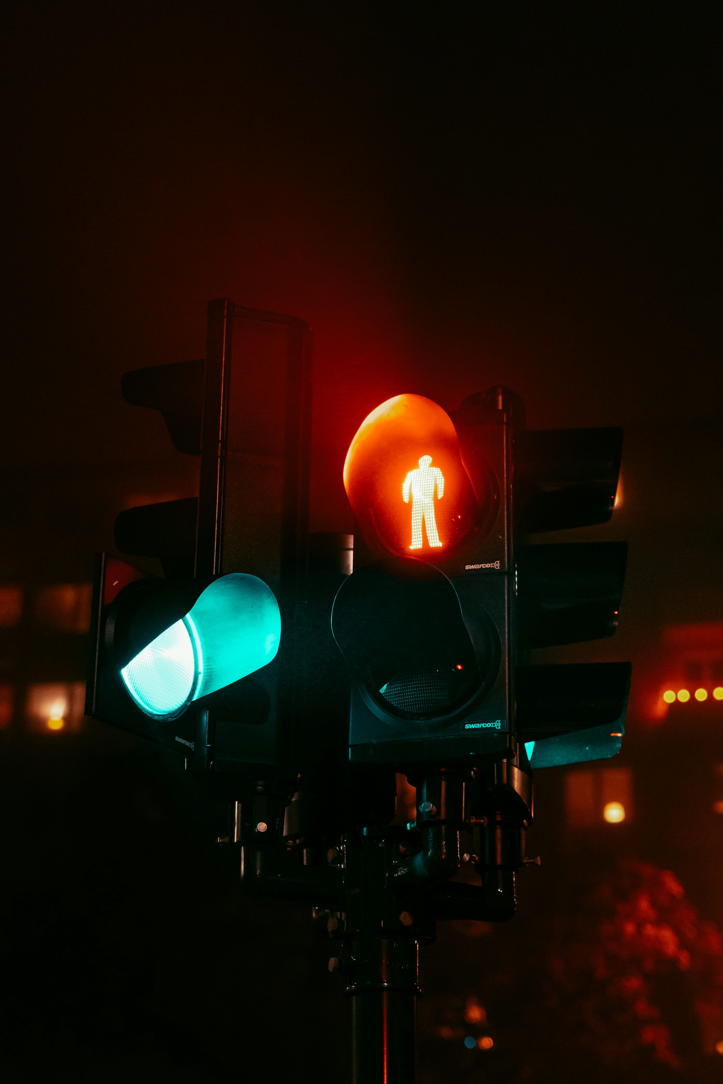 3000x4500 A traffic light with a red light and a green light photo
