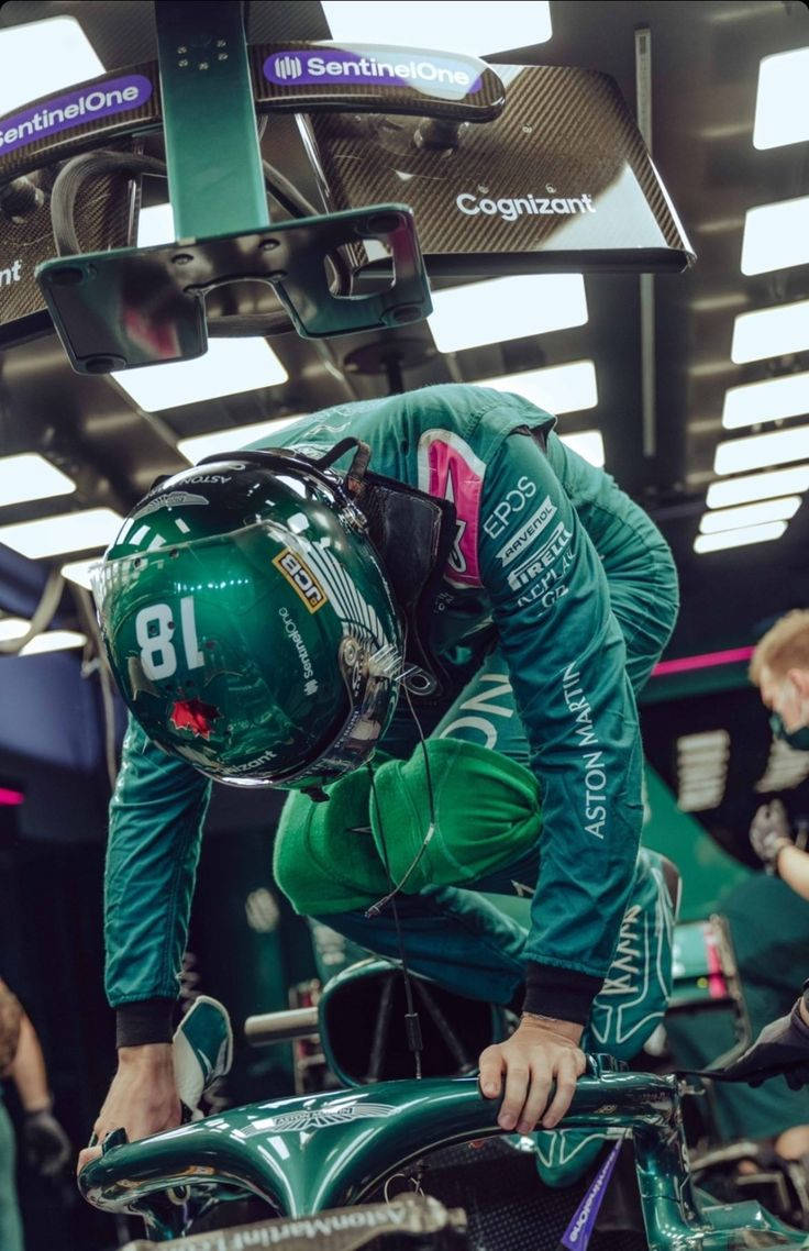 736x1138 Download Formula 1 Driver, Lance Stroll gearing up to take a ride in his racing car. Wallpaper