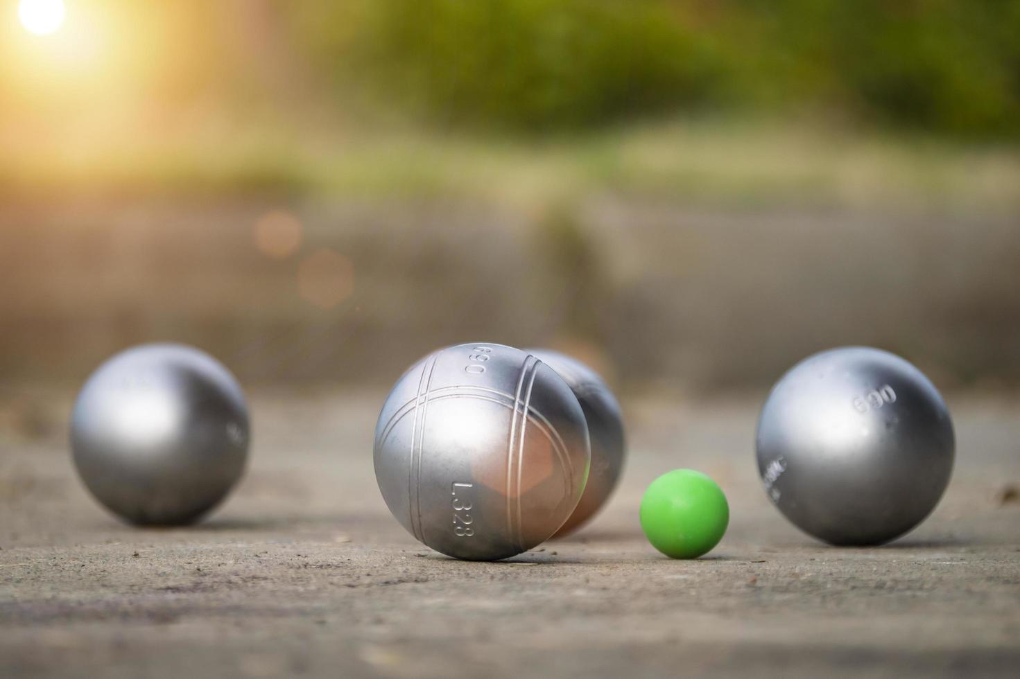 1471x980 Petanque balls in the playing field with shady as a backdrop