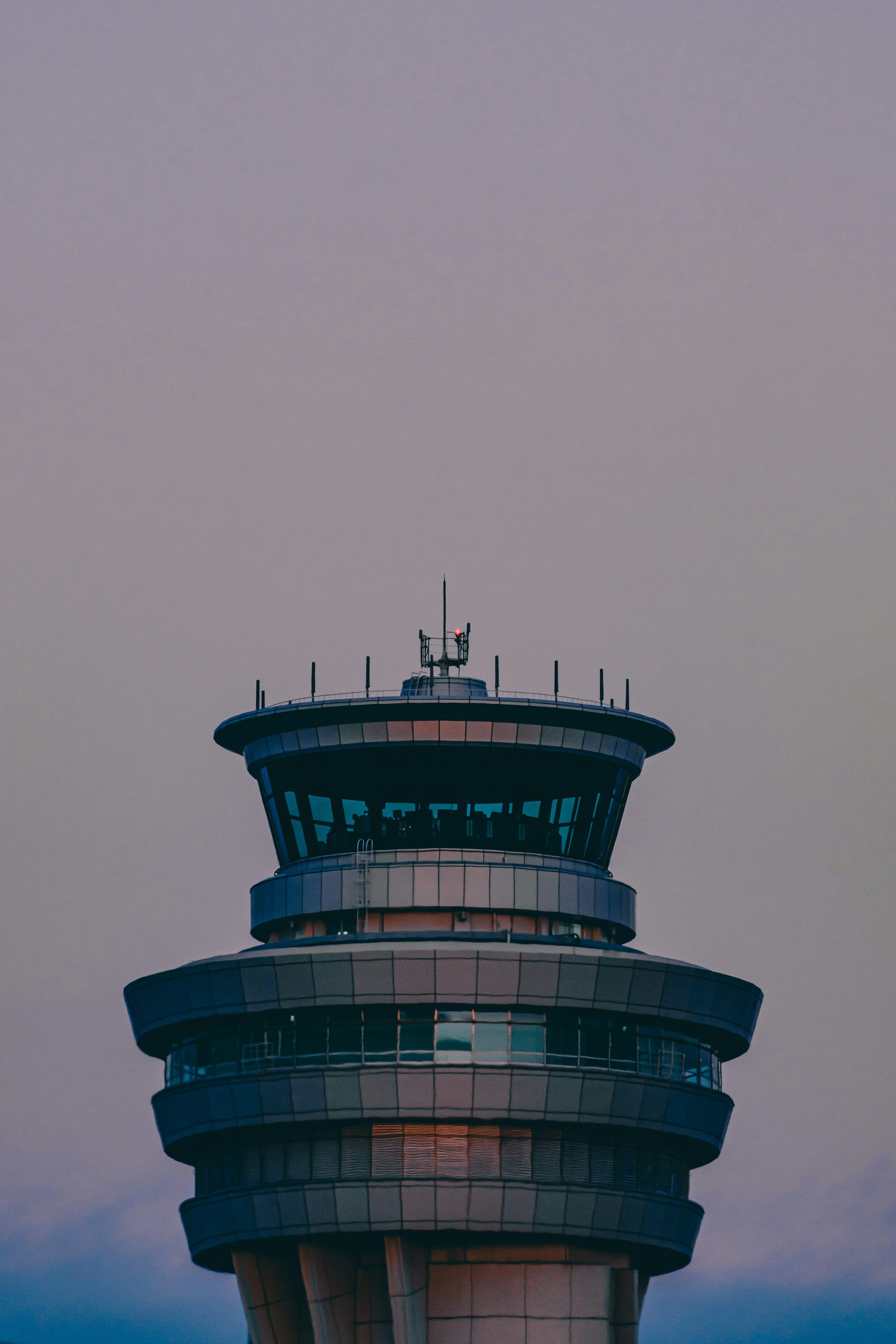 3000x4500 Airport control tower against a clear, blue sky. photo