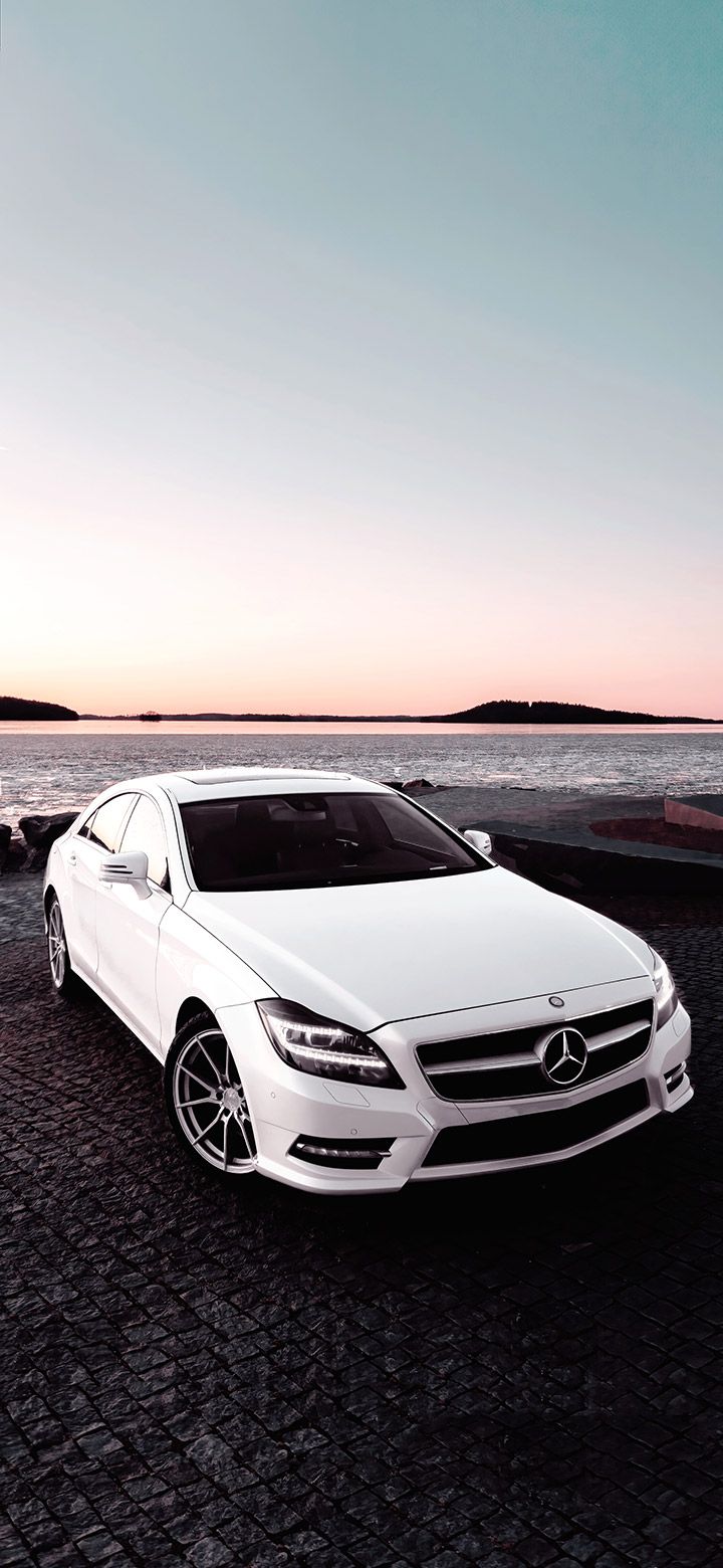 720x1560 White Mercedes Cls Parked Near Sea 4K phone Wallpaper