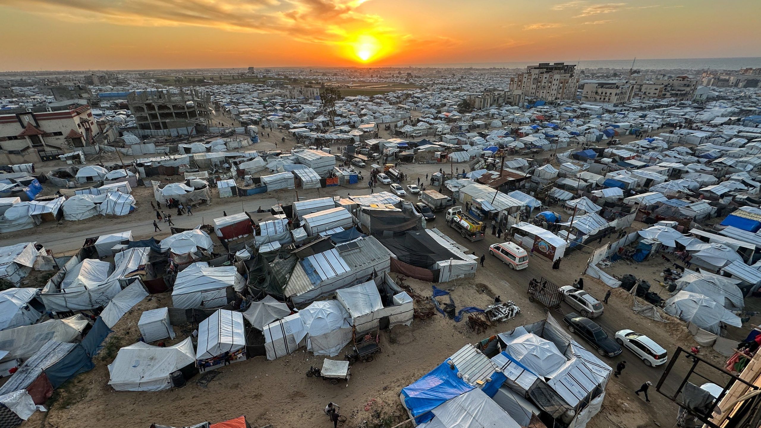 2560x1440 Israel bans dozens of aid groups from Gaza, including Caritas, drawing condemnation