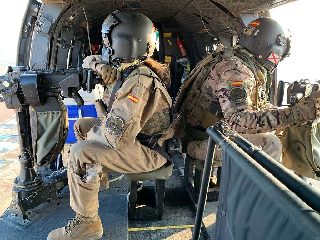 1024x768 Spanish army soldiers look out the sides of an AS332