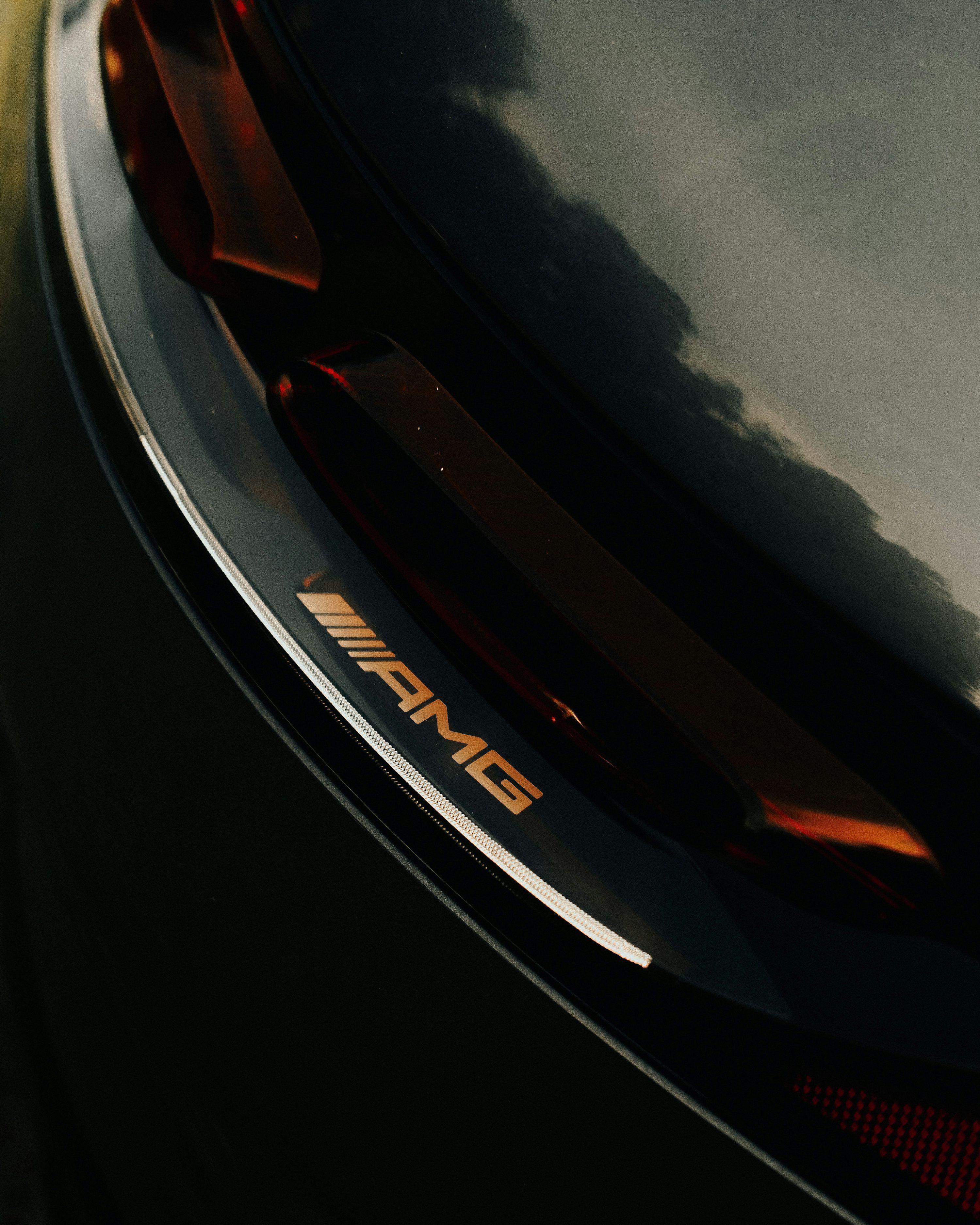 3000x3750 A close up of the emblem on a white car photo