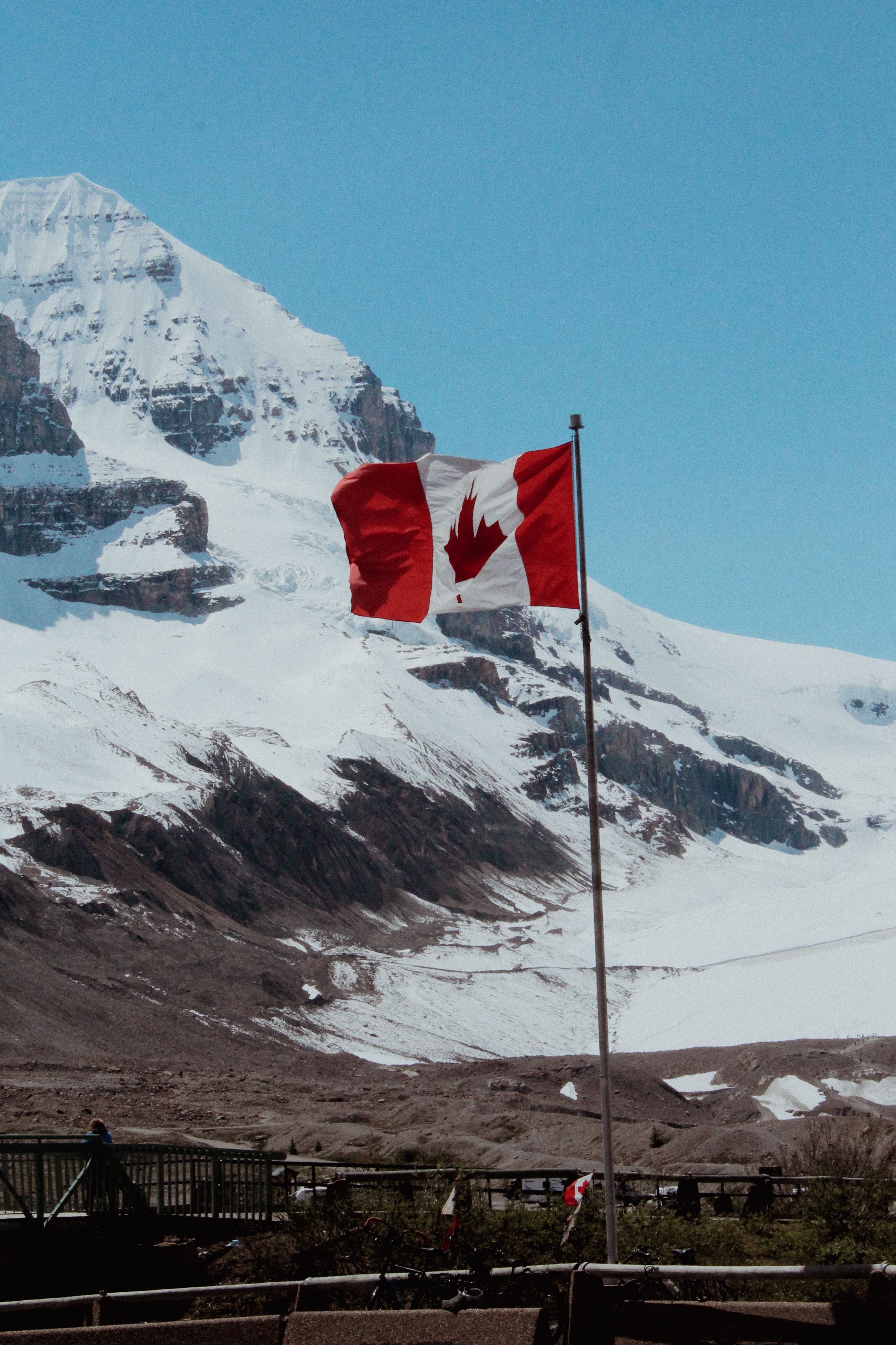 3023x4536 Canadian Flag in a Mountain Valley · Free