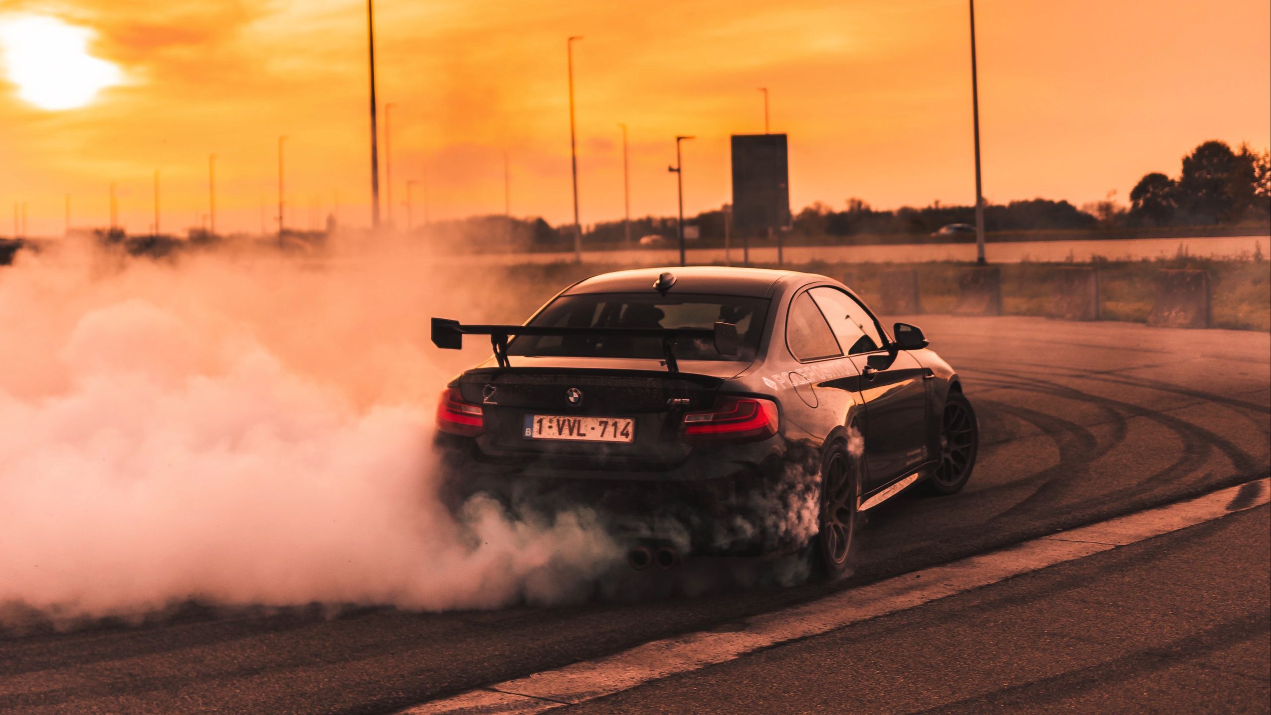 2560x1440 Download wallpaper 2560x1440 bmw, speed, drift, smoke, sunset widescreen 16:9 HD background