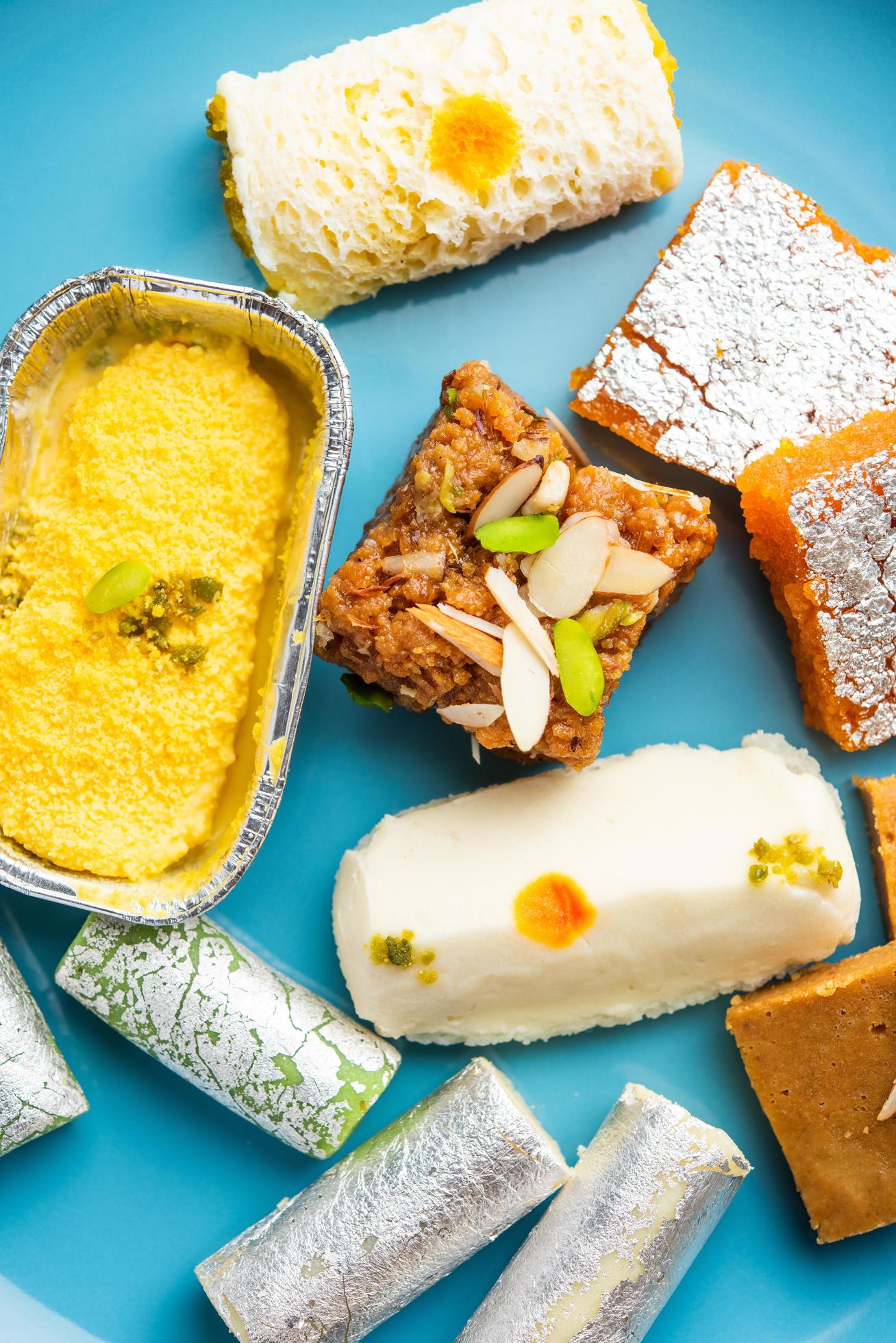 1308x1960 Indian assorted sweet mithai, barfi in a group