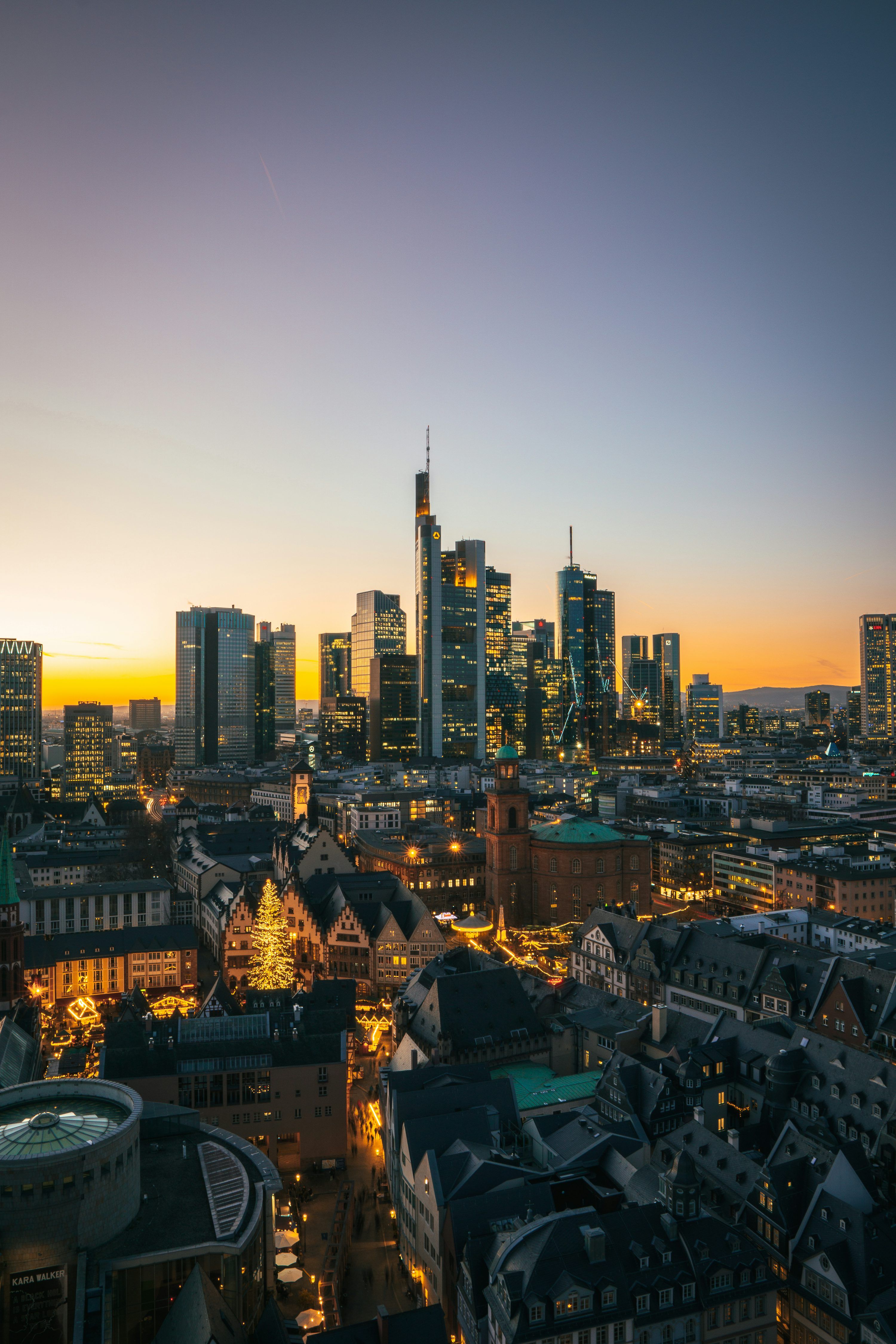 3000x4500 A view of a city at night from the top of a building photo