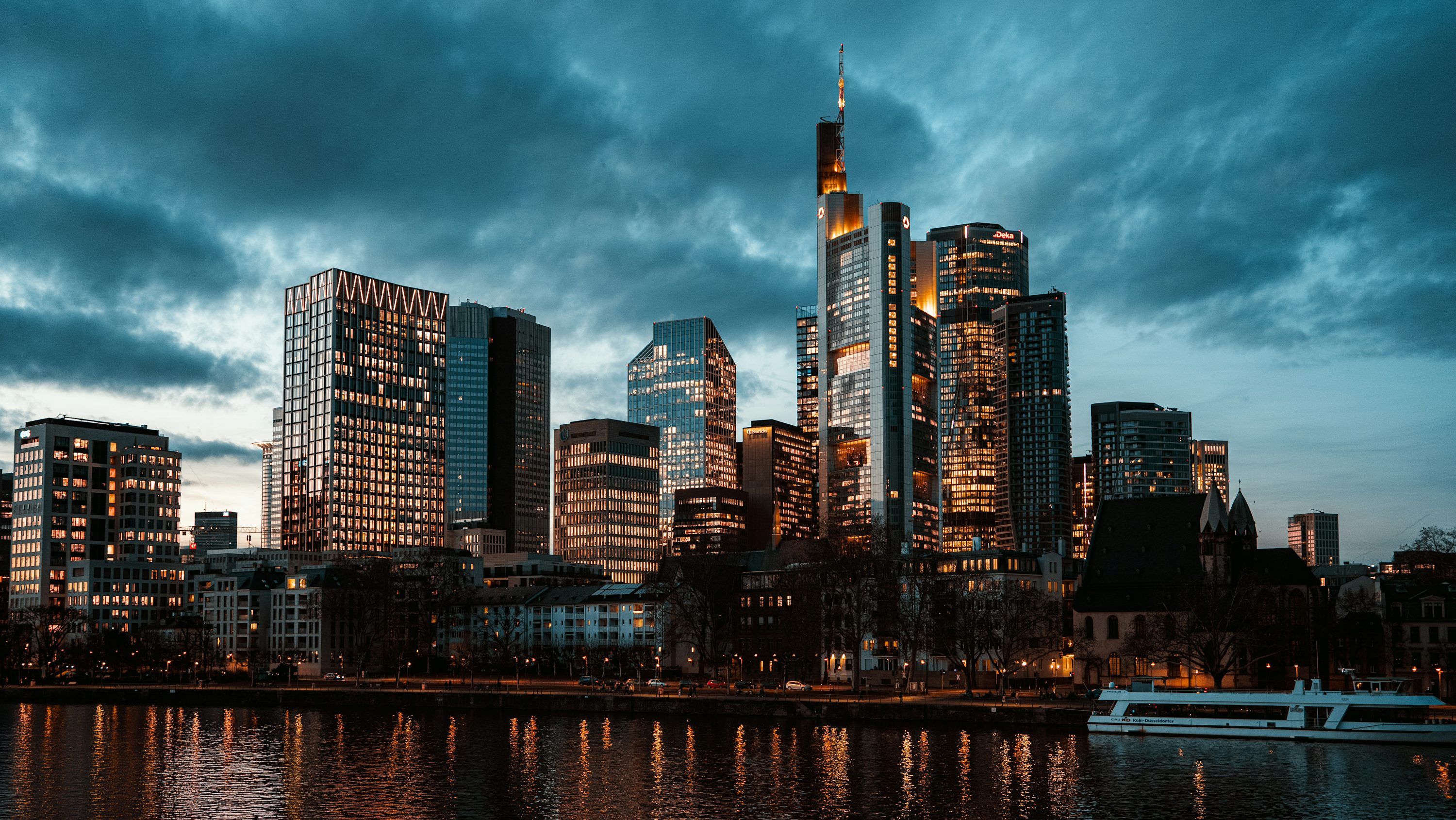 3000x1689 Modern city skyline with skyscrapers at dusk photo
