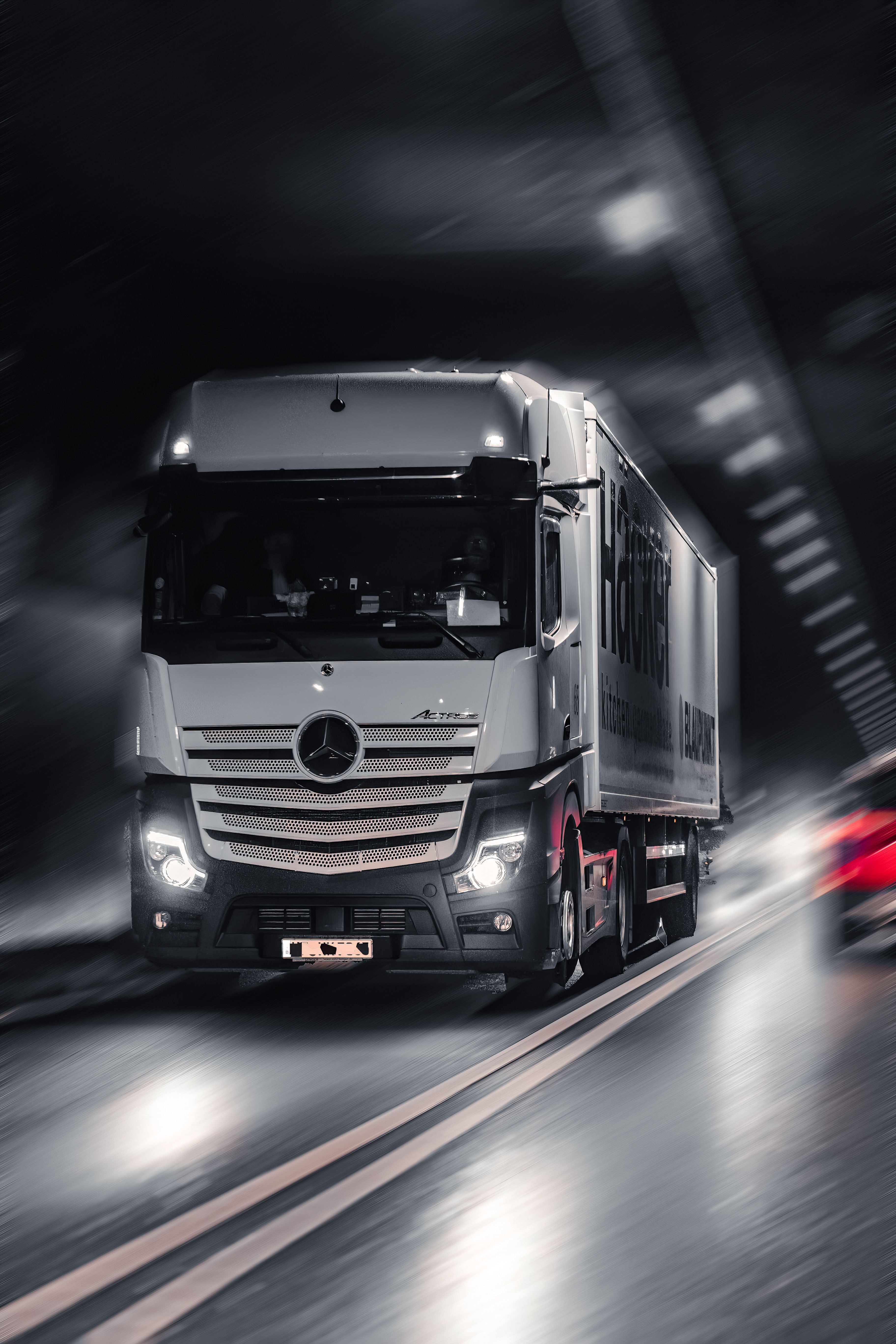 3648x5472 View Of A Mercedes Benz Actros Driving On A Street · Free
