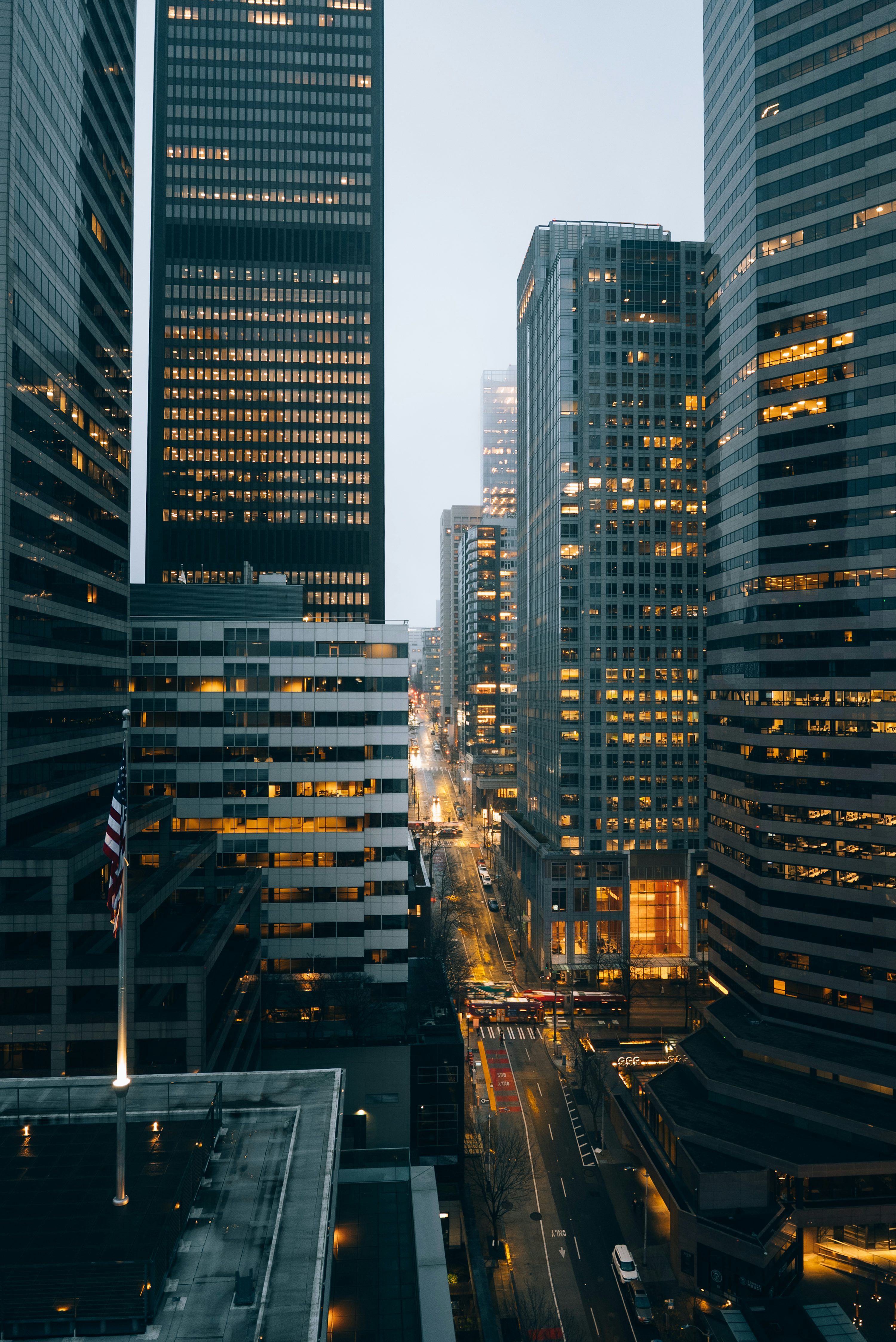 3000x4492 City buildings at night with lights on. photo