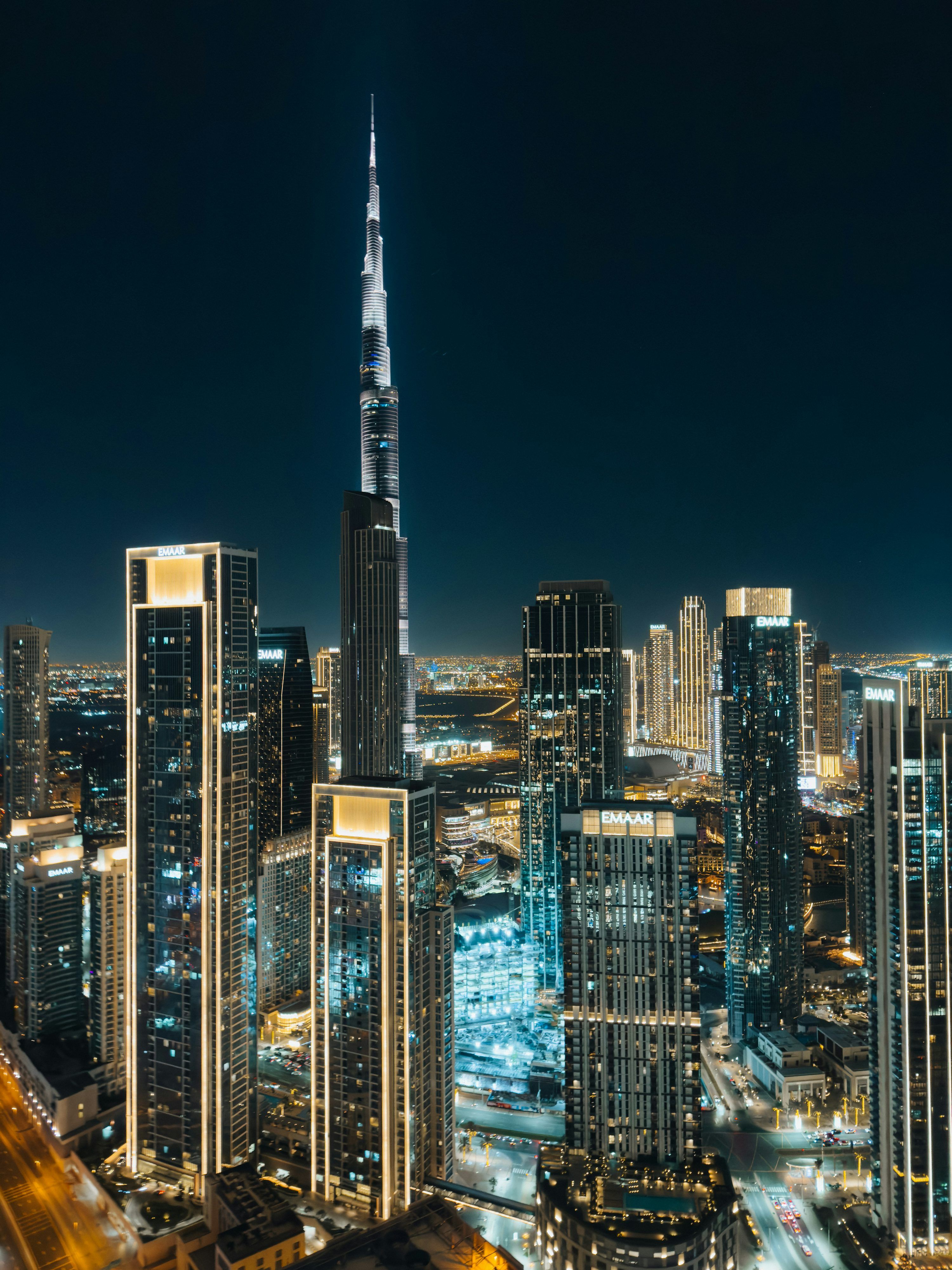 3000x4000 A view of a city at night from the top of a building photo